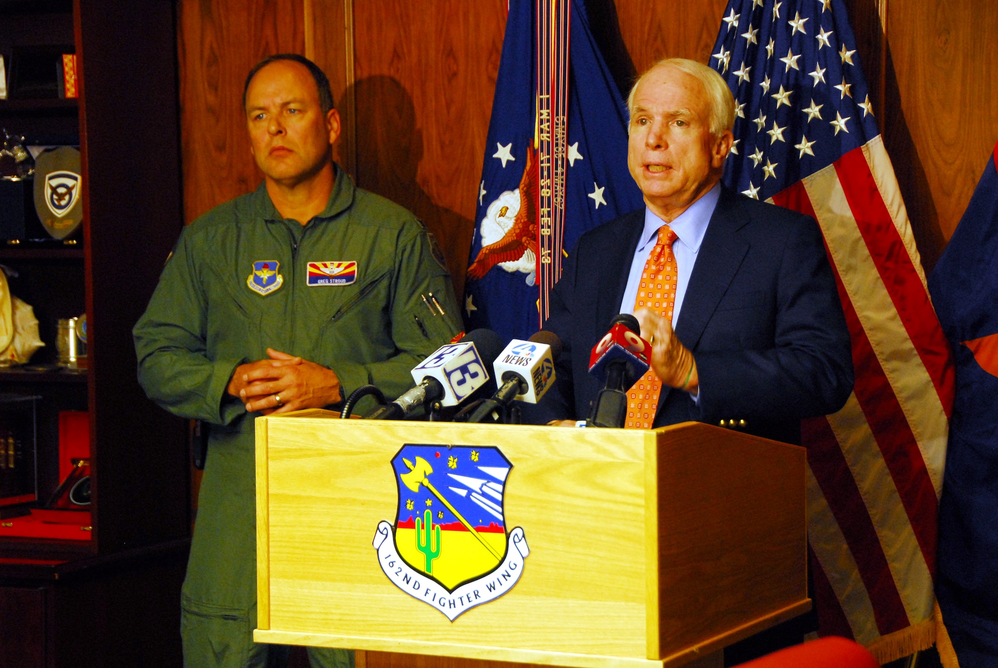 U.S. Senator John McCain and Col. Greg Stroud, 162nd Fighter Wing commander, answer questions during  a news conference Nov. 24 at the Arizona Air National Guard base at Tucson International Airport. Senator McCain visited to show support for the wing and its future.  (U.S Air Force photo by Master Sgt. David Neve)