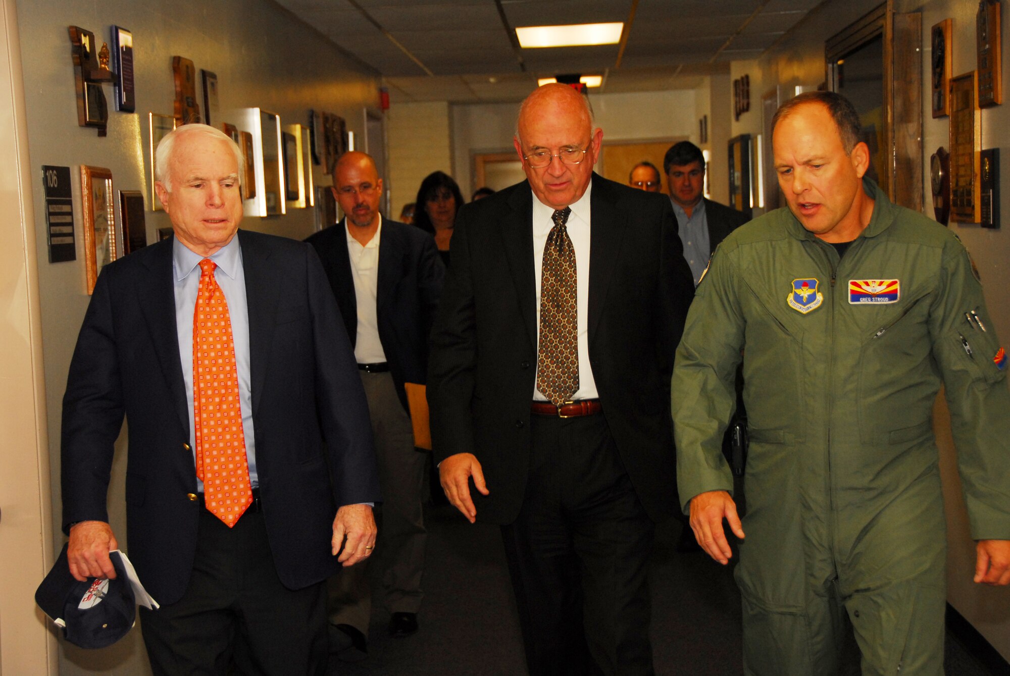 U.S. Senator John McCain, Tucson Mayor Bob Walkup, and Col. Greg Stroud, 162nd Fighter Wing commander, head to a news conference Nov. 24 at the Arizona Air National Guard base at Tucson International Airport.  Senator McCain visited to show support for the wing and its future.  (U.S Air Force photo by Master Sgt. David Neve)