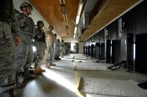 MINOT AIR FORCE BASE, N.D. -- Airmen wait to begin the final portion of Air Force Qualification Course on a Combat Arms Training and Maintenance range Nov. 24 here. CATM is one of the most important services on any base, as they provide all Airmen with weapons training. (U.S. Air Force photo by Senior Airman Matthew Smith) 