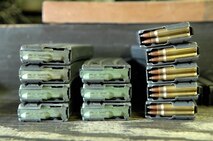 MINOT AIR FORCE BASE, N.D. -- Magazines and ammunition sit on a table waiting to be fired during the Air Force Qualification Course on a Combat Arms Training and Maintenance range Nov. 24 here. CATM is one of the most important services on any base, as they provide all Airmen with weapons training. (U.S. Air Force photo by Senior Airman Matthew Smith)