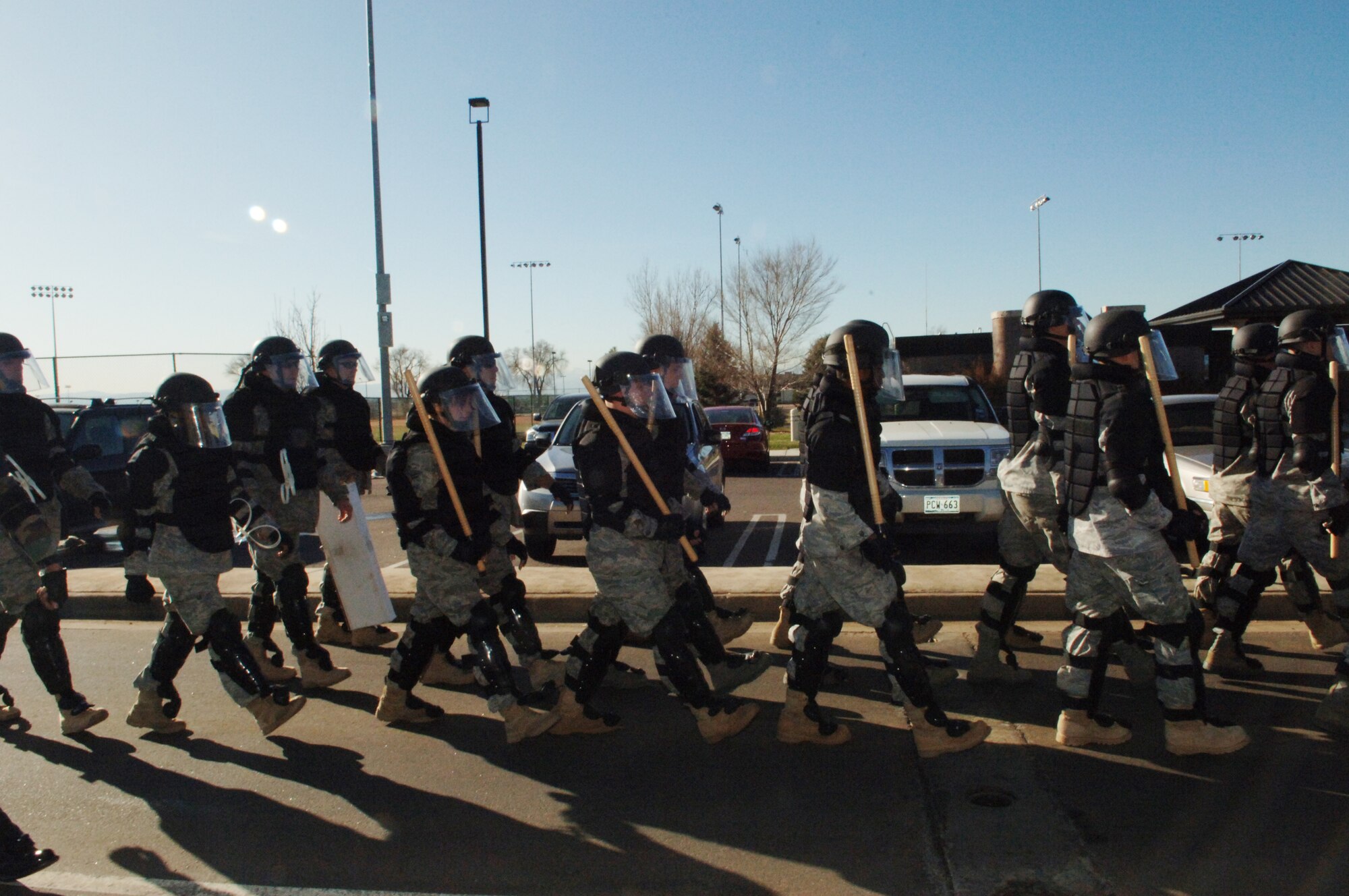 BUCKLEY AIR FORCE BASE, Colo. -- Members of the 460th Space Wing confrontation management team respond to mock protesters during an exercise Nov. 24. (U. S. Air Force photo by Tech. Sgt Shirley Henderson)
