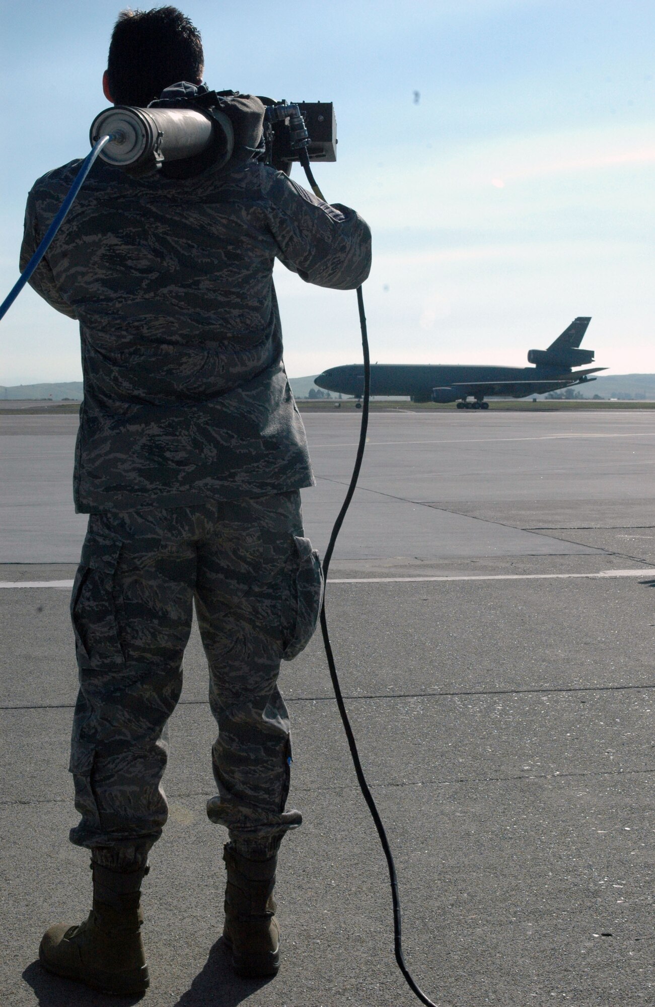 A Team Travis member practices using simulated Man Portable Air Defense Systems on the flighline recently Nov. 4. The training is designed to bring awareness of some of the most dangerous and prevalent threats to mobility aircraft around the world at a demonstration organized by the 60th Operations Support Squadron. (U.S. Air Force photo/Senior Airman Kristen Rohrer)