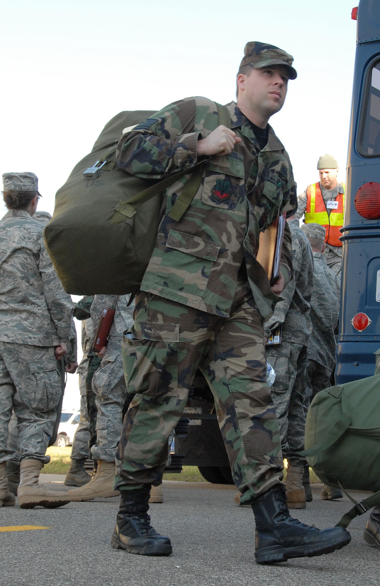 Tech. Sgt. Joseph Lobbezoo carries his deployment bag to be weighed at the 110th Fighter Wing, Battle Creek, Mi., Nov. 7, 2009. Lobbezoo was participating in a mobility training exercise at the base. (U.S. Air Force photo by Tech. Sgt. David Eichaker/released)