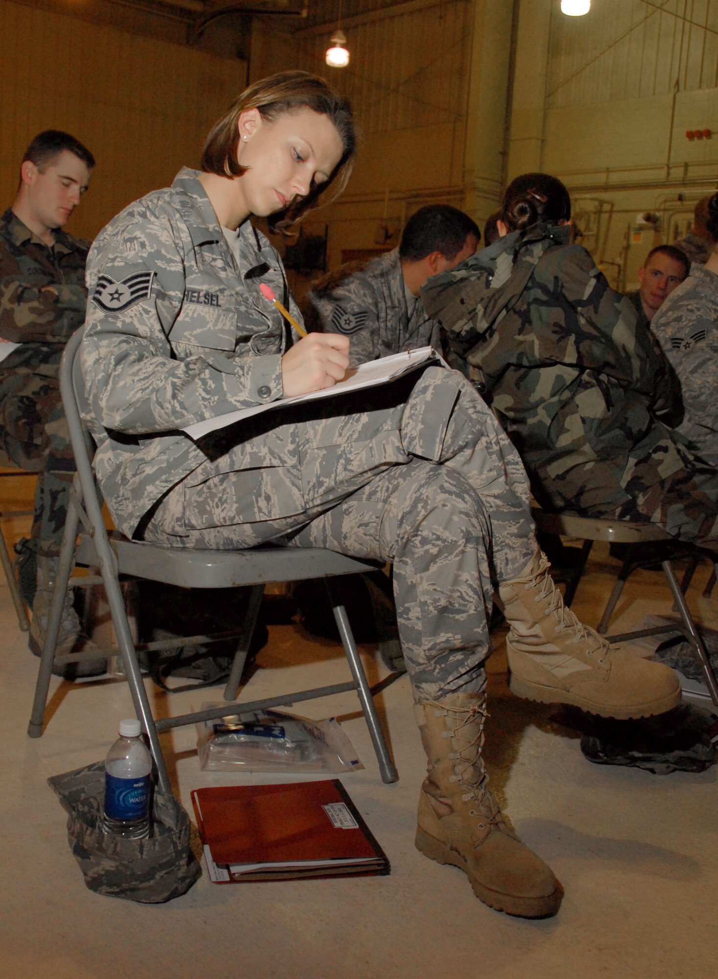 Staff. Sgt. Amber Helsel reviews paperwork in the briefing room at the 110th Fighter Wing, Battle Creek, Mi., Nov. 7, 2009. Helsel was participating in a mobility training exercise at the base. (U.S. Air Force photo by Tech. Sgt. David Eichaker/released)