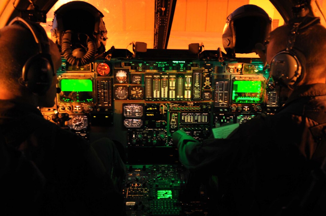 ELLSWORTH AIR FORCE BASE, S.D.-- (Left) Capt. Derek Oakley and Maj. Chris Lovegren, 34th Bomb Squadron pilots, work their way through pre-flight checklists from the cockpit of a B-1B Lancer before takeoff Nov. 23. This flight is Captain Oakley's aircraft commander certification flight. (U.S. Air Force photo/Airman 1st Class Corey Hook)
