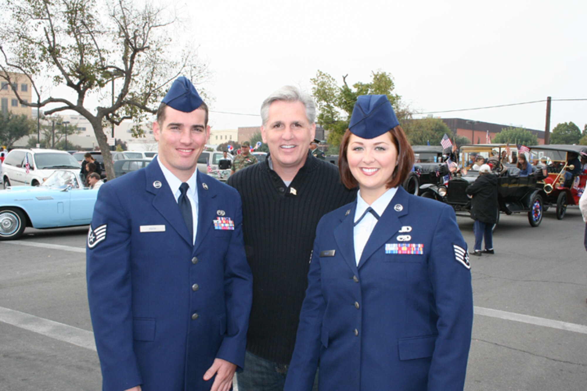 MOUNTAIN HOME AIR FORCE BASE, Idaho -- Staff Sergeants Aimee Roth, 366th Fighter Wing, and her husband John Roth, 366th Component Maintenance Squadron, stand with California Congressman Kevin McCarthy during the Bakersfield, Calif. Veterans Day parade Nov 11.  The Roths were chosen from 147 entries to serve as the parade king and queen to pay tribute to the military men and women who have served this country. Aimee Roth is from Bakersfield and John Roth is from Santa Maria, Calif.