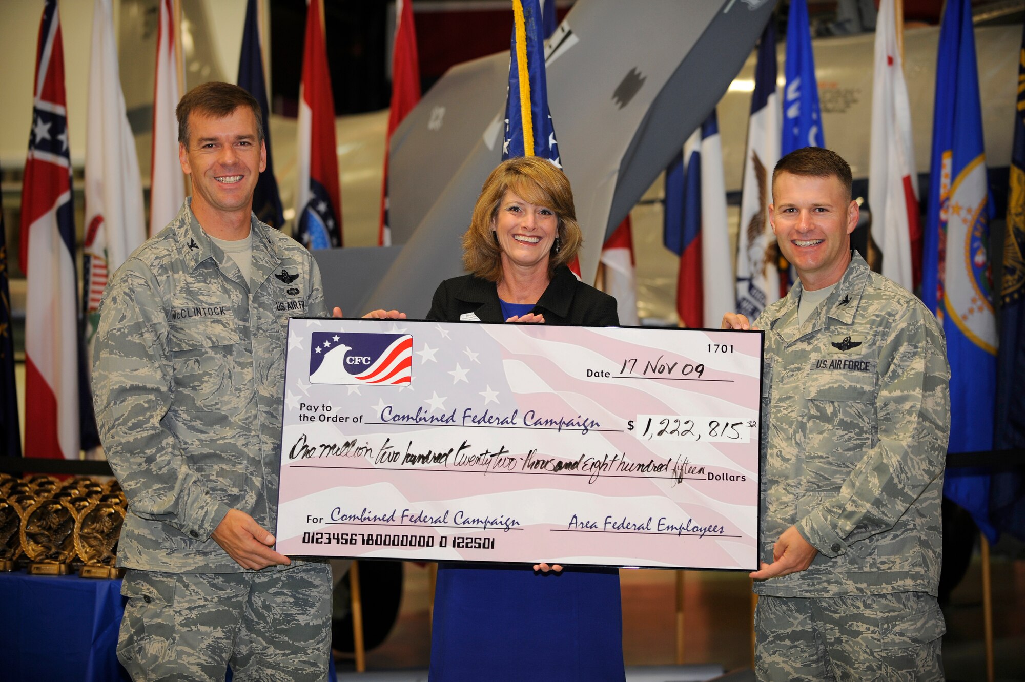 Col. Bruce McClintock, 96th Air Base Wing commander, and Col. Gregory Lengyel, 1st Special Operations Wing commander (right), present a check to Jeanne Dailey, chairman of the board for United Way, Okaloosa-Walton counties, during the 2009 Combined Federal Campaign breakfast.  Federal agencies in both counties raised more than $1.2 million during the six-week campaign.  (U.S. Air Force photo by Senior Airman Jason Epley)