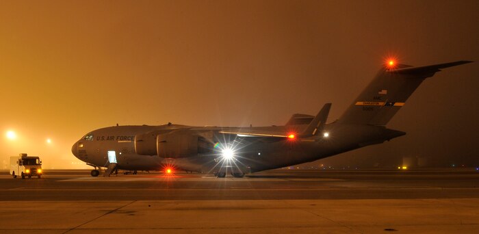 A Charleston AFB C-17 is parked on the flightline while Airmen from the 437th Aircraft Maintenance Squadron perform a maintenance engine run here Nov. 19. The 437 AMXS is responsible for the maintenance of the 59 C-17s assigned to Charleston AFB with a combined value of more than $10 billion. (U.S. Air Force photo/James Bowman)