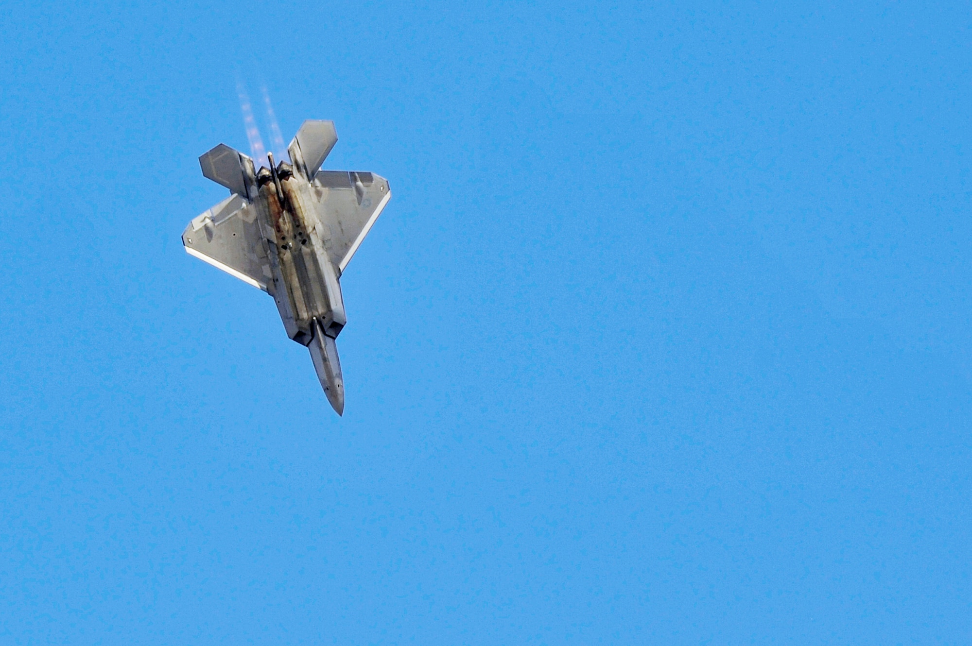 An F-22 Raptor performs a dive Nov. 15, 2009 at the Dubai Air Show in the United Arab Emirates. The F-22 provides the Air Force with a combination of stealth, supercruise, maneuverability and integrated avionics. (U.S. Air Force photo/Tech. Sgt. Charles Larkin Sr.)
