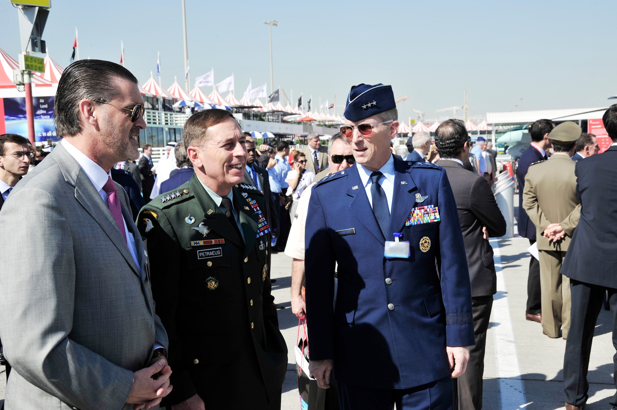 Richard Olsen, the U.S. Ambassador to the United Arab Emirates, Army Gen. David Petraeus, the U.S. Central Command commander and Lt. Gen. Mike Hostage, the U.S. Air Forces Central Command commander, stop to talk Nov. 15, 2009 at the Dubai Air Show in the United Arab Emirates. (U.S. Air Force photo/Tech. Sgt. Charles Larkin Sr.)
