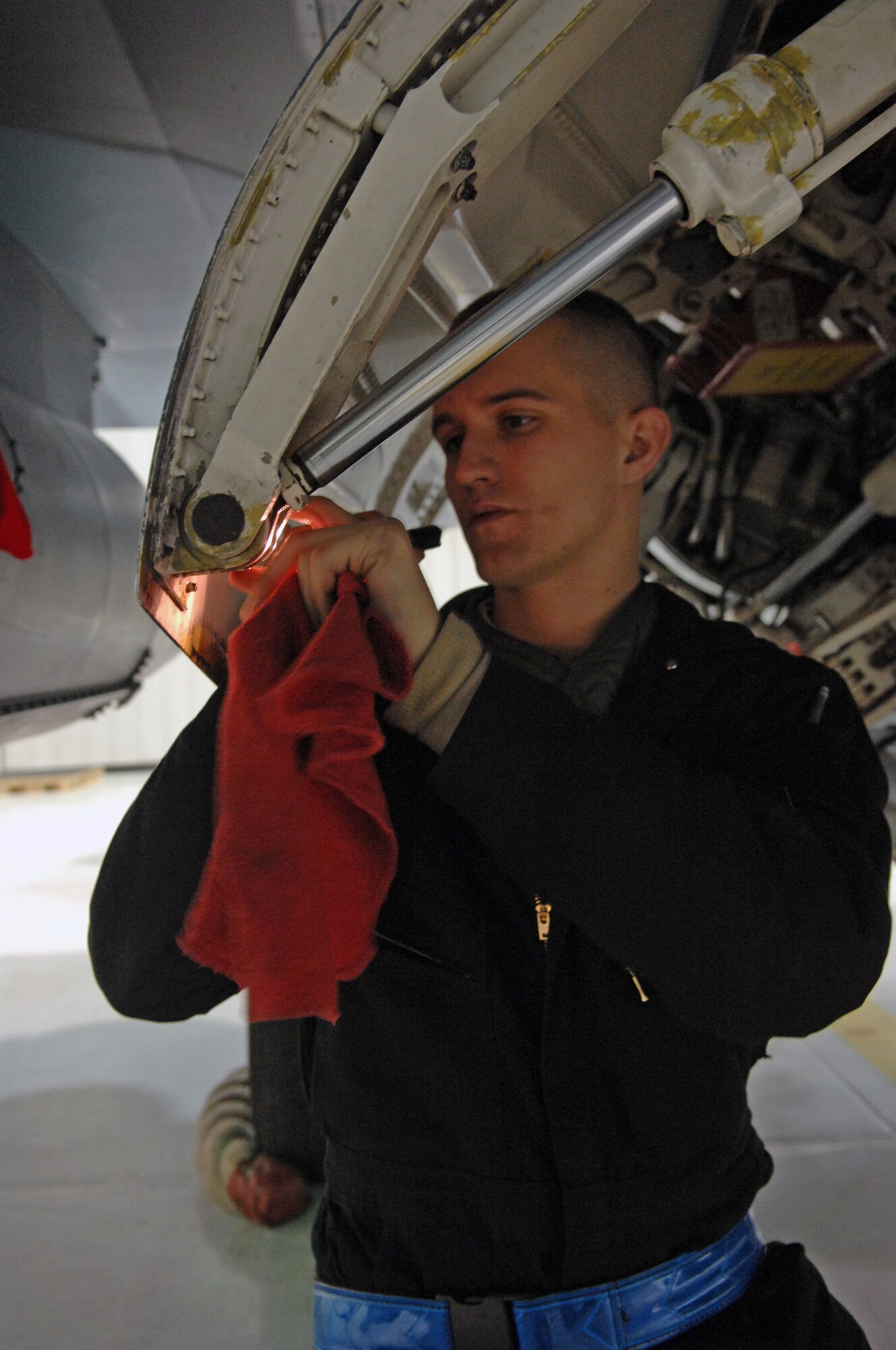 Airman 1st Class Jacob Williams performs routine post-flight maintenance on an F-16 Fighting Falcon Nov. 23, 2009, Eielson Air Force Base, Alaska. Airmen inspect every aircraft before and after every flight to ensure safety. Airman Williams is a crew chief assigned to the 18th Aircraft Maintenance Unit. (U.S. Air Force photo/ Airman 1st Class Rachelle Coleman)