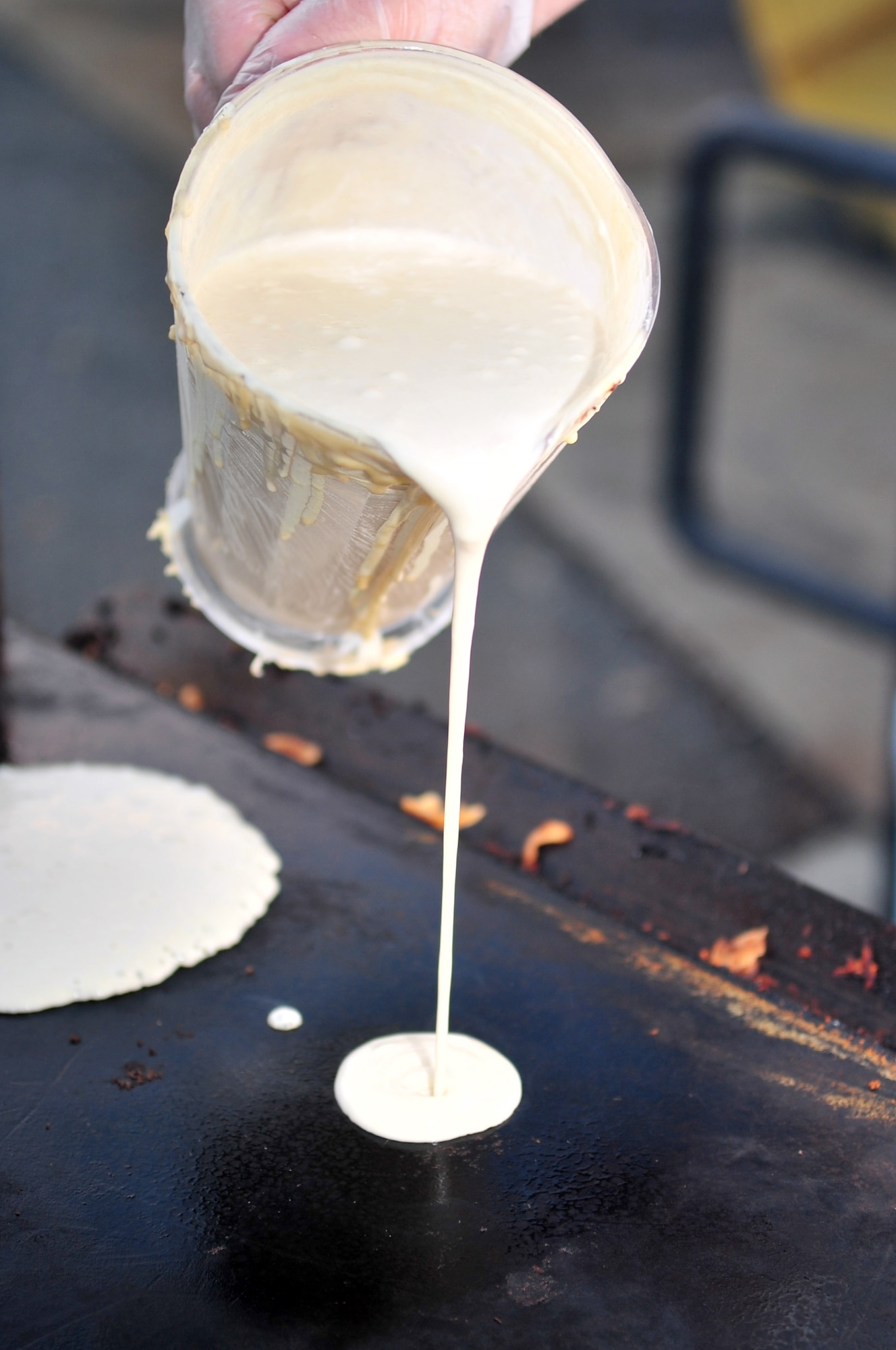 Pancake batter is poured on the grill for a Chief's Pancake Breakfast on Seymour Johnson Air Force Base, N.C., Nov. 20, 2009. During this breakfast, base chief's served more than 700 Airmen including guests of honor Frances and Steve Archer, the widow and son of Chief Master Sgt. Fred Archer. (U.S. Air Force photo/Airman 1st Class Rae Perry)