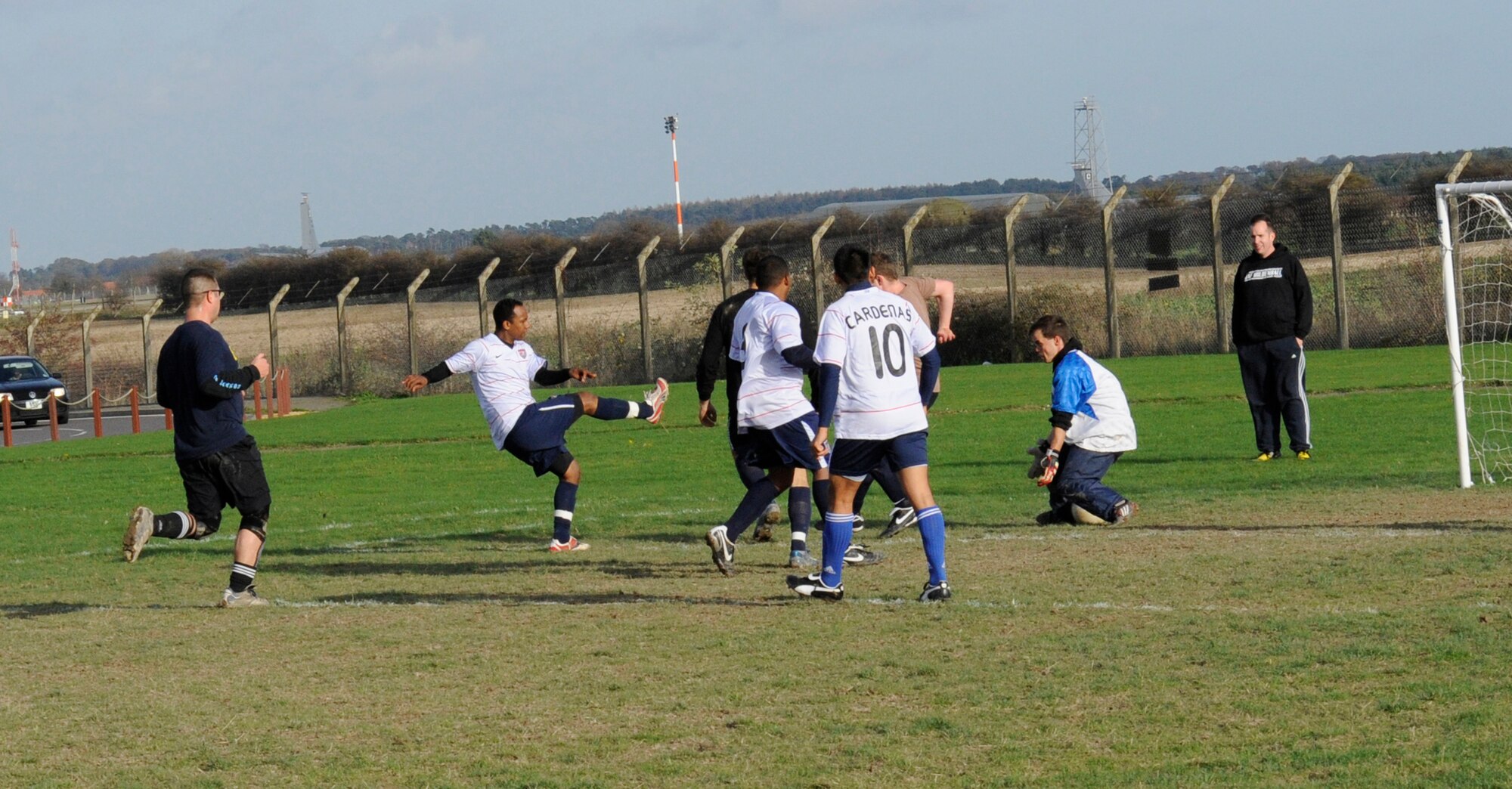 Kibrom Retta, scores the second goal for the 100th Logistics Readiness Squadron, by sending the ball under the keeper’s legs and into the net during the intramural soccer championship game at the Hardstand Fitness Center Nov. 19. Logistics Readiness Squadron comforably defeated the 488th Intelligence Squadron/95th Reconnaissance Squadron 2-0 with a goal in each half. (U.S. Air Force photo/Staff Sgt. Christopher L. Ingersoll)