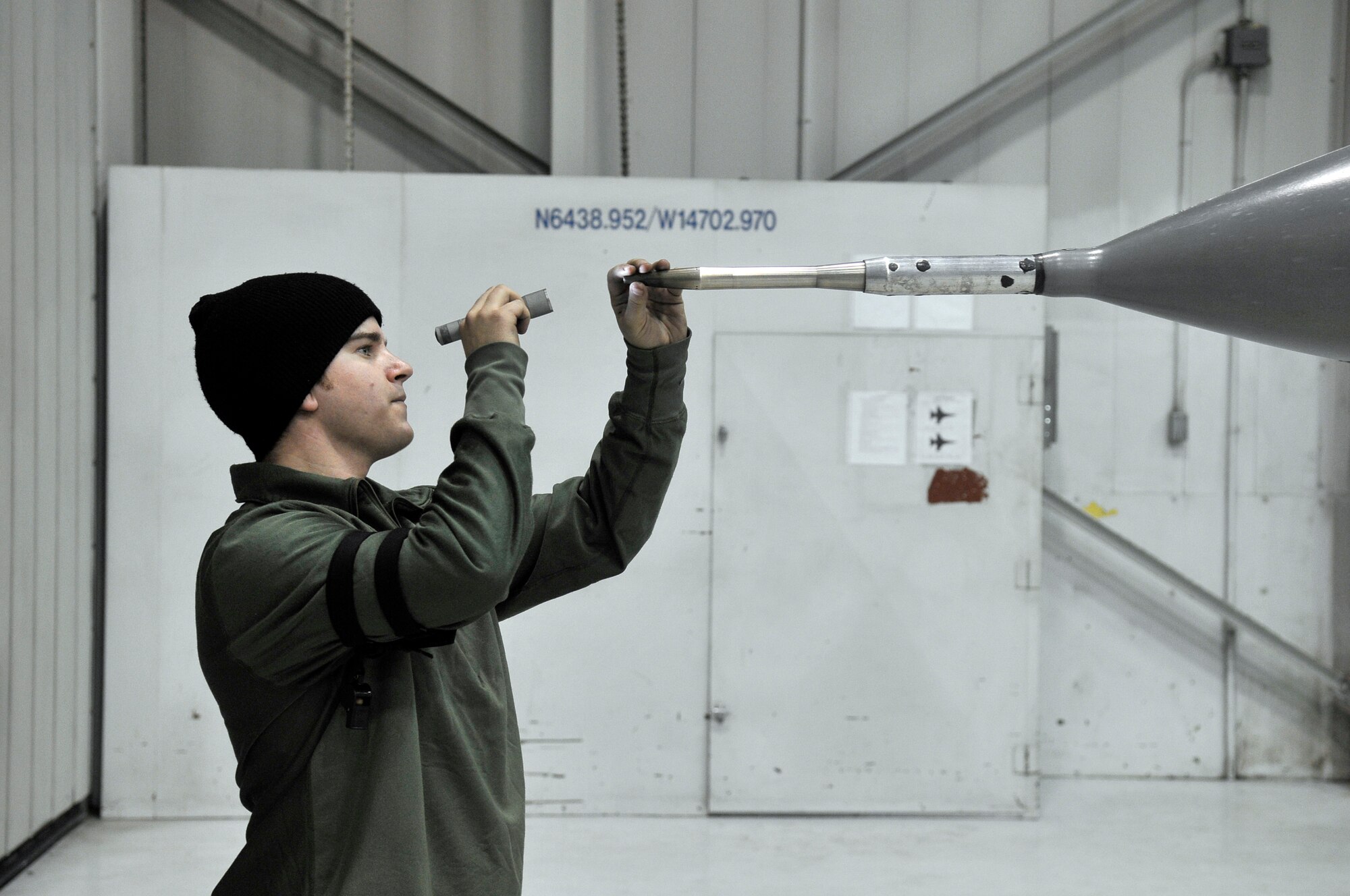 Airman 1st Class Joshua Mee checks the probe on the tip of an F-16 Fighting Falcon Nov. 23, 2009, Eielson Air Force Base, Alaska. Airmen inspect every aircraft before and after every flight to ensure safety. Airman Mee is a crew chief assigned to the 18th Aircraft Maintenance Unit. (U.S. Air Force photo/ Airman 1st Class Janine Thibault)