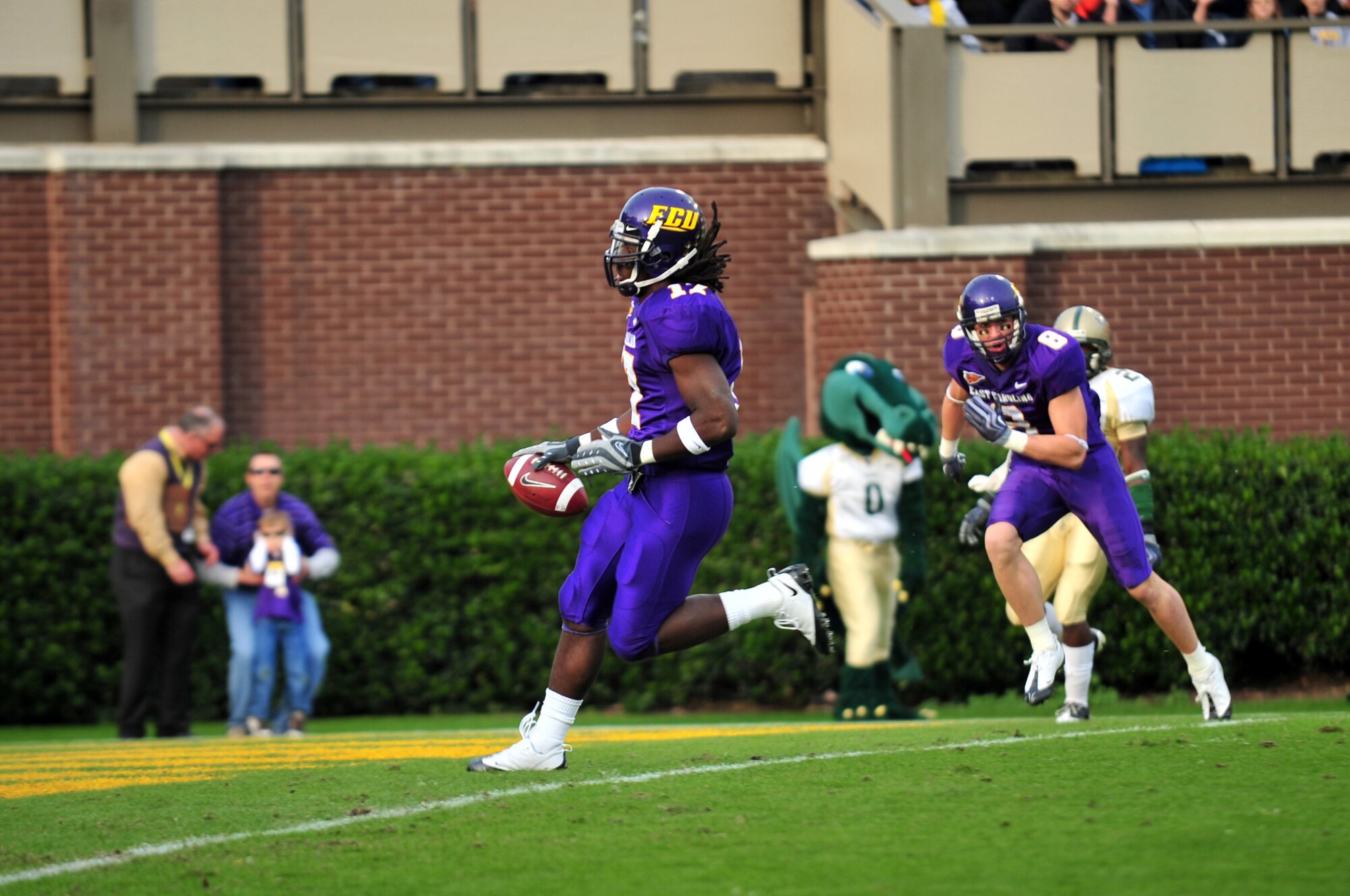 Dwayne Harris, East Carolina University wide receiver, scores the first touchdown of the game on a 23-yard pass from quarterback Pat Pinkney at the ECU Dowdy-Ficklen Stadium, Greenville, N.C., Nov. 21, 2009. ECU staff and students invited active-duty military members to the game to thank them for their service. (U.S. Air Force photo/Airman 1st Class Rae Perry) 