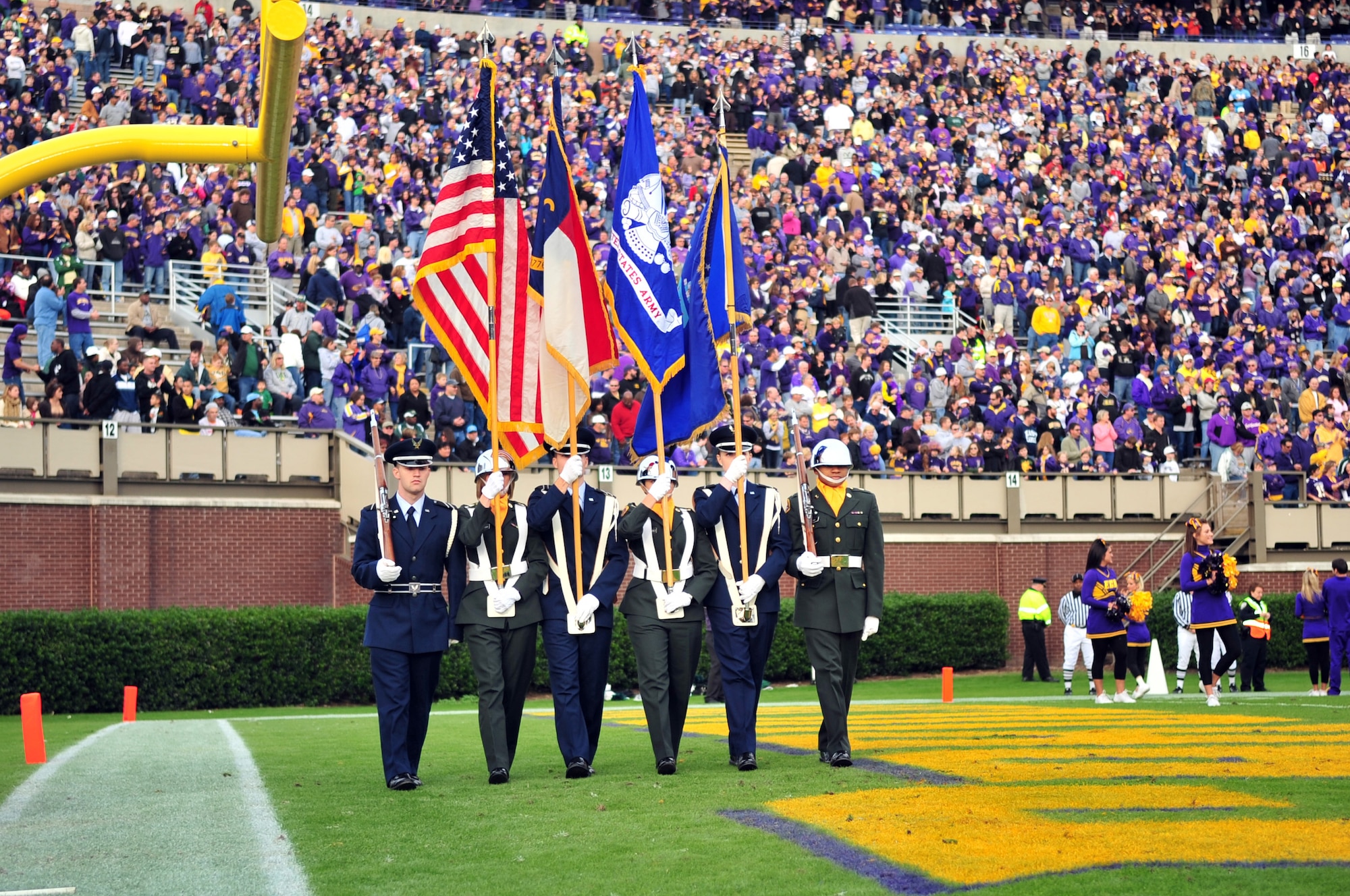 Members of the East Carolina University Air Force and Army Reserve Officer Training Corps present the colors during the Military Appreciation Day football game against University of Alabama at Birmingham in the ECU Dowdy-Ficklen Stadium, Greenville, N.C., Nov. 21, 2009. The college donated 300 tickets for the game to Airmen serving at Seymour Johnson Air Force Base, N.C. (U.S. Air Force photo/Airman 1st Class Rae Perry)