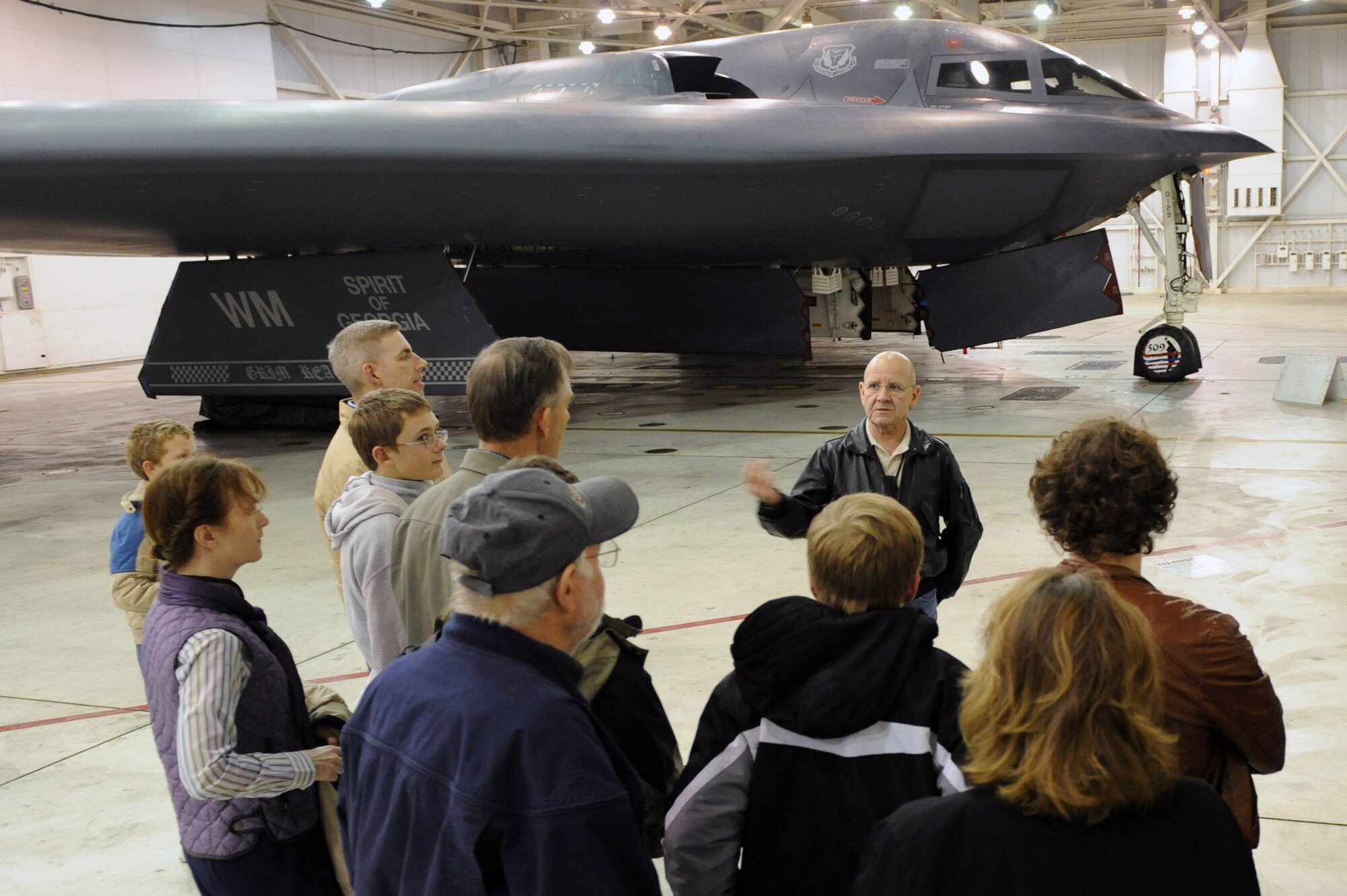 Ken Gallagher, Northrop-Grumman director and site manager, explains some of the B-2's features to the Heartland Home Educators Stealth Robotics team on Nov. 17. The HHESRT competes in the Boosting Engineering Science and Technology series of competitions, and took home 1st place in the most recent competition in Harrison, Ark.
(U.S. Air Force photo/ Senior Airman Jason Huddleston)(Released)
