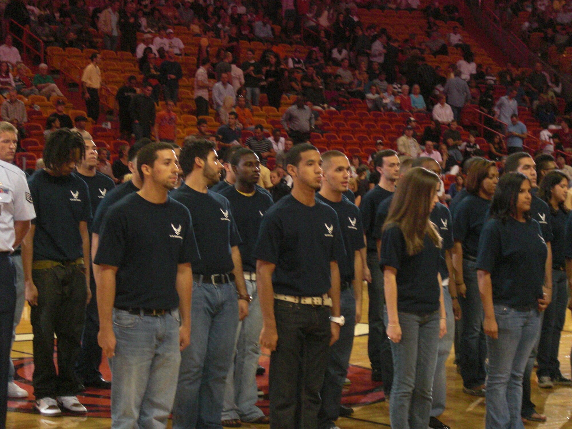 Miami, FL – The National Basketball Association’s Miami Heat, held a military appreciation night to honor the newest recruits in the Miami, Florida area.  

Forty young men and women were administered the oath of enlistment in front of a crowd of approximately 15,000 Miami Heat fans.   

The oath of enlistment is recited by every member of the Air Force, not only as a commitment to the Air Force, but a commitment to the nation.  

These young men and women were honored to be sworn in by Lt. Col. Greg Thomas, U.S. Air Force Thunderbird team commander.  

One of the United States Air Forces newest recruits, Carlos Encarnacion who is 21 years of age said “I felt honored to be sworn in front of my home town crowd and I am honored to be part of the greatest Air Force in the world”. 

The efforts of the Miami Heat to honor the United States military show the patriotism of the Miami area and help boost the recruiting efforts of the men and women of the 333rd Recruiting Squadron, Melbourne, Fla.  

The United States Air Force Thunderbirds Aerial Demonstration Team was in Miami and Homestead, Florida to be the main event in the Wings over Homestead Air Show November 7 - 8, 2009. 
