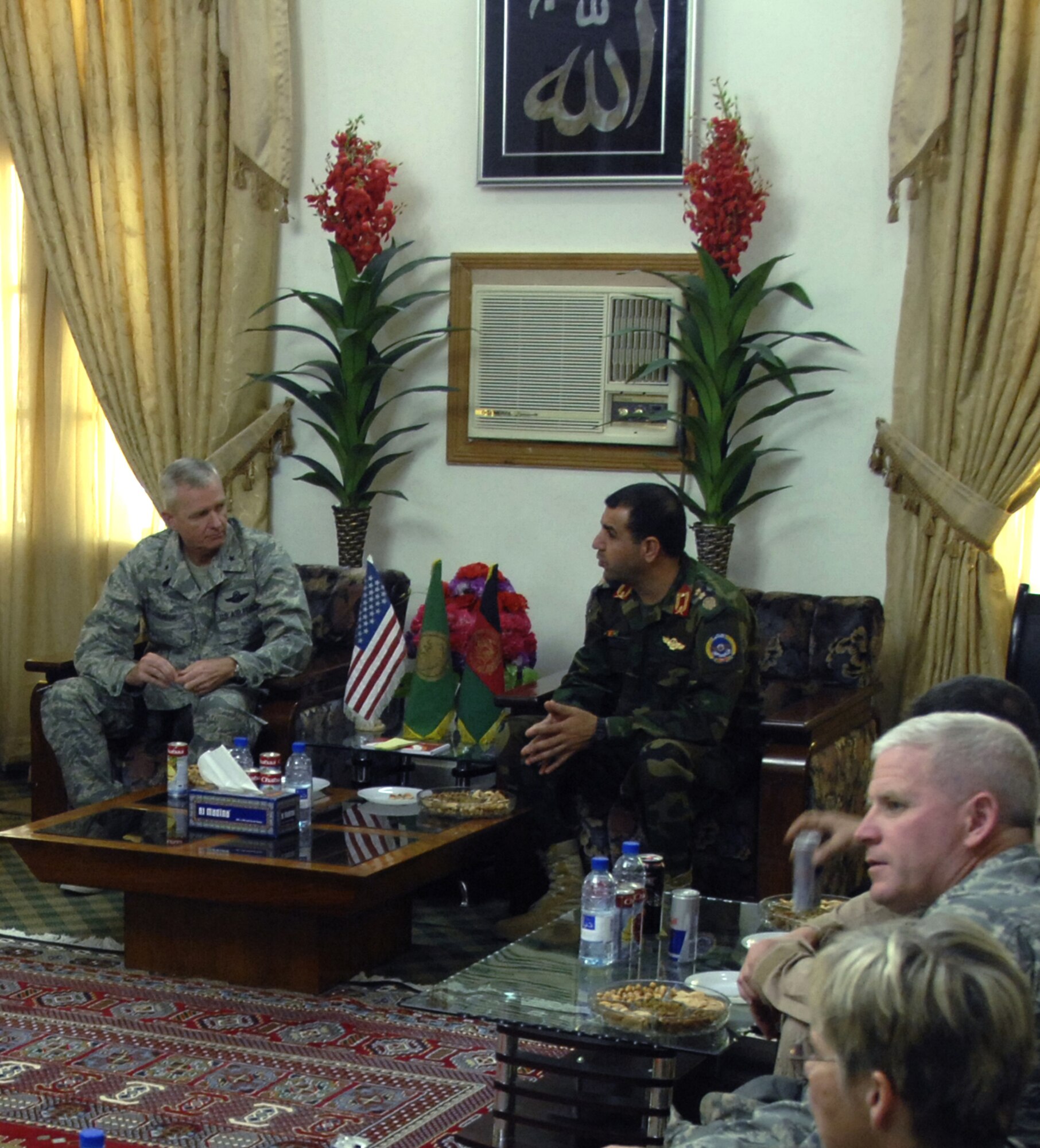 Brigadier General Guy Walsh (left) and Maj. Gen. Abduhl Raziq Sherzai (right) talk over lunch at General Serzai’s office Nov. 18. Several members of the 451st Air Expeditionary Wing, including top enlisted Airmen, chiefs and officers, accompanied General Walsh to lunch with General Sherzai to enjoy a freshly cooked Afghanistan meal. General Walsh is the 451st AEW commander, and General Sherzai is the commander of the Afghanistan National Army Air Corps. (U.S. Air Force photo/Senior Airman Timothy Taylor)