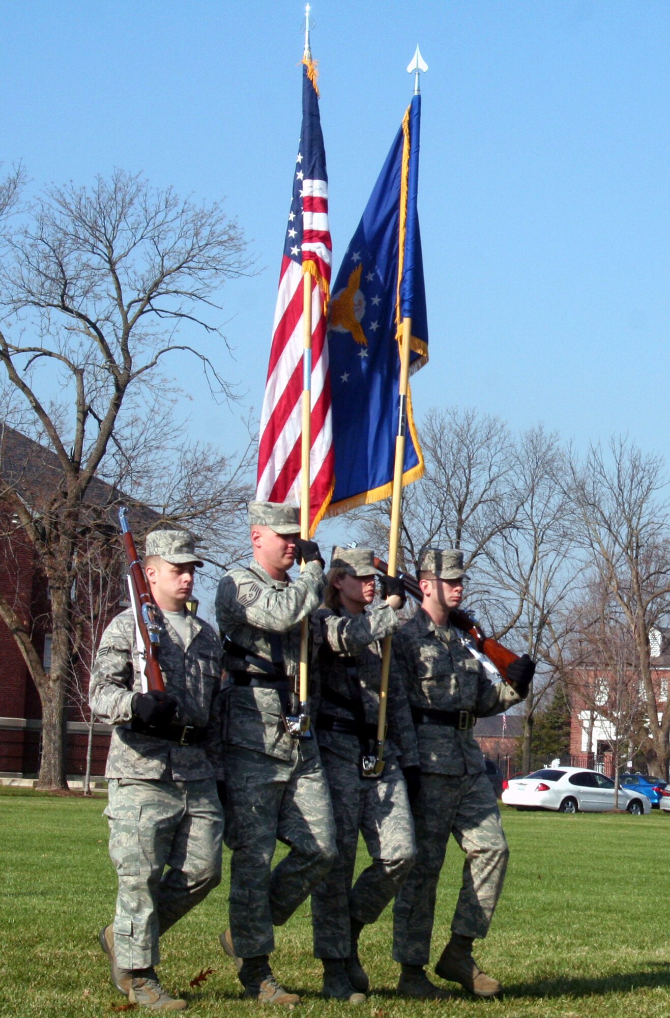 Airmen assigned to the color guard participate in the Air Mobility Command change of command ceremony on Nov. 20, 2009, at Scott Air Force Base, Ill.  During the ceremony, Gen. Raymond E. Johns took command of AMC. (U.S. Air Force Photo/Tech. Sgt. Scott T. Sturkol)