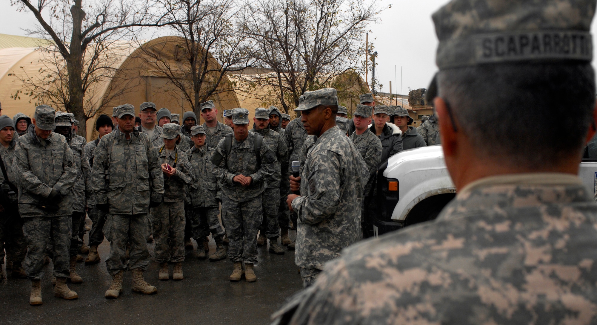 BAGRAM AIRFIELD, Afghanistan -- Senior Army leaders from Combined Joint Task Force - 82 address a crowd of Airmen in front of 455th Air Expeditionary Wing headquarters Nov. 23, 2009. Maj. Gen. Curtis Scaparrotti, CJTF-82 commander, and Command Sgt. Major Thomas Capel thanked them for their contributions to the mission in Afghanistan. "We know your families miss you, but it's important for us to be here," General Scaparrotti said. "Soldiers and Marines on the ground know they can rely on Airmen to bring them air power when they need it." (U.S. Air Force photo/Staff Sgt. J.G. Buzanowski)