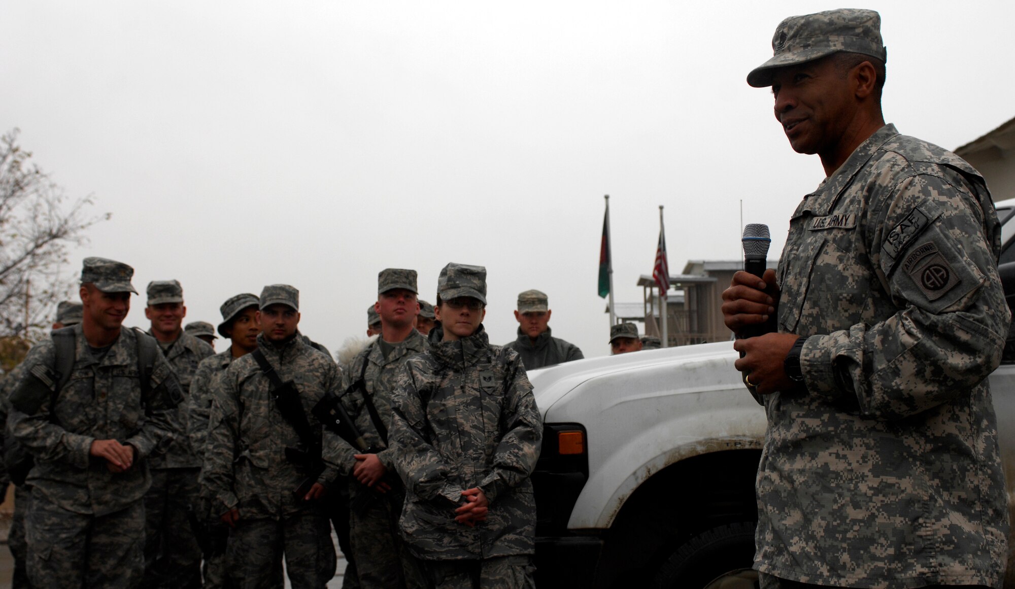 BAGRAM AIRFIELD, Afghanistan -- Senior Army leaders from Combined Joint Task Force - 82 address a crowd of Airmen in front of 455th Air Expeditionary Wing headquarters Nov. 23, 2009. Maj. Gen. Curtis Scaparrotti, CJTF-82 commander, and Command Sgt. Major Thomas Capel thanked them for their contributions to the mission in Afghanistan. "We know your families miss you, but it's important for us to be here," General Scaparrotti said. "Soldiers and Marines on the ground know they can rely on Airmen to bring them air power when they need it." (U.S. Air Force photo/Staff Sgt. J.G. Buzanowski)