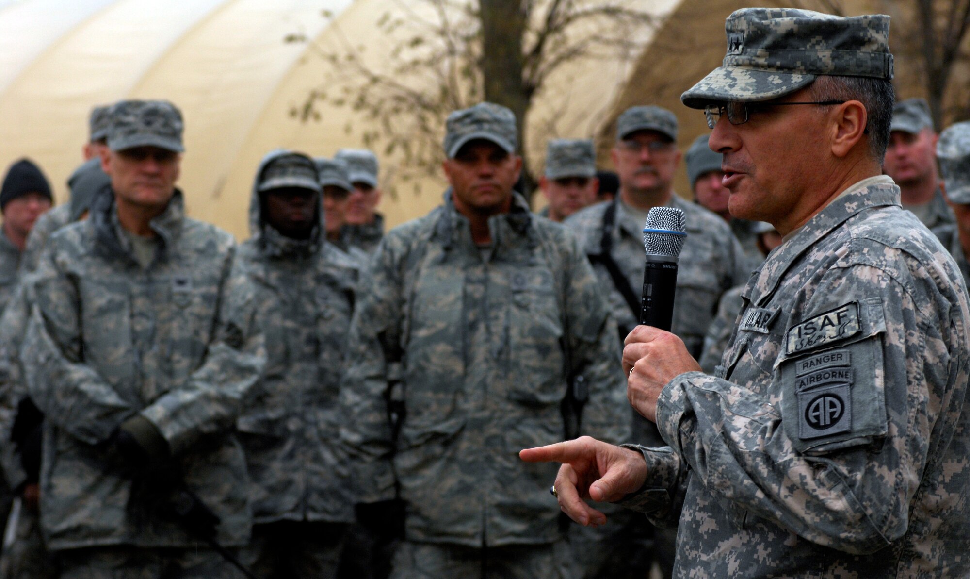 BAGRAM AIRFIELD, Afghanistan -- Senior Army leaders from Combined Joint Task Force - 82 address a crowd of Airmen in front of 455th Air Expeditionary Wing headquarters Nov. 23, 2009. Maj. Gen. Curtis Scaparrotti, CJTF-82 commander, and Command Sgt. Major Thomas Capel thanked them for their contributions to the mission in Afghanistan. "We know your families miss you, but it's important for us to be here," General Scaparrotti said. "Soldiers and Marines on the ground know they can rely on Airmen to bring them air power when they need it." (U.S. Air Force photo/Staff Sgt. J.G. Buzanowski)
