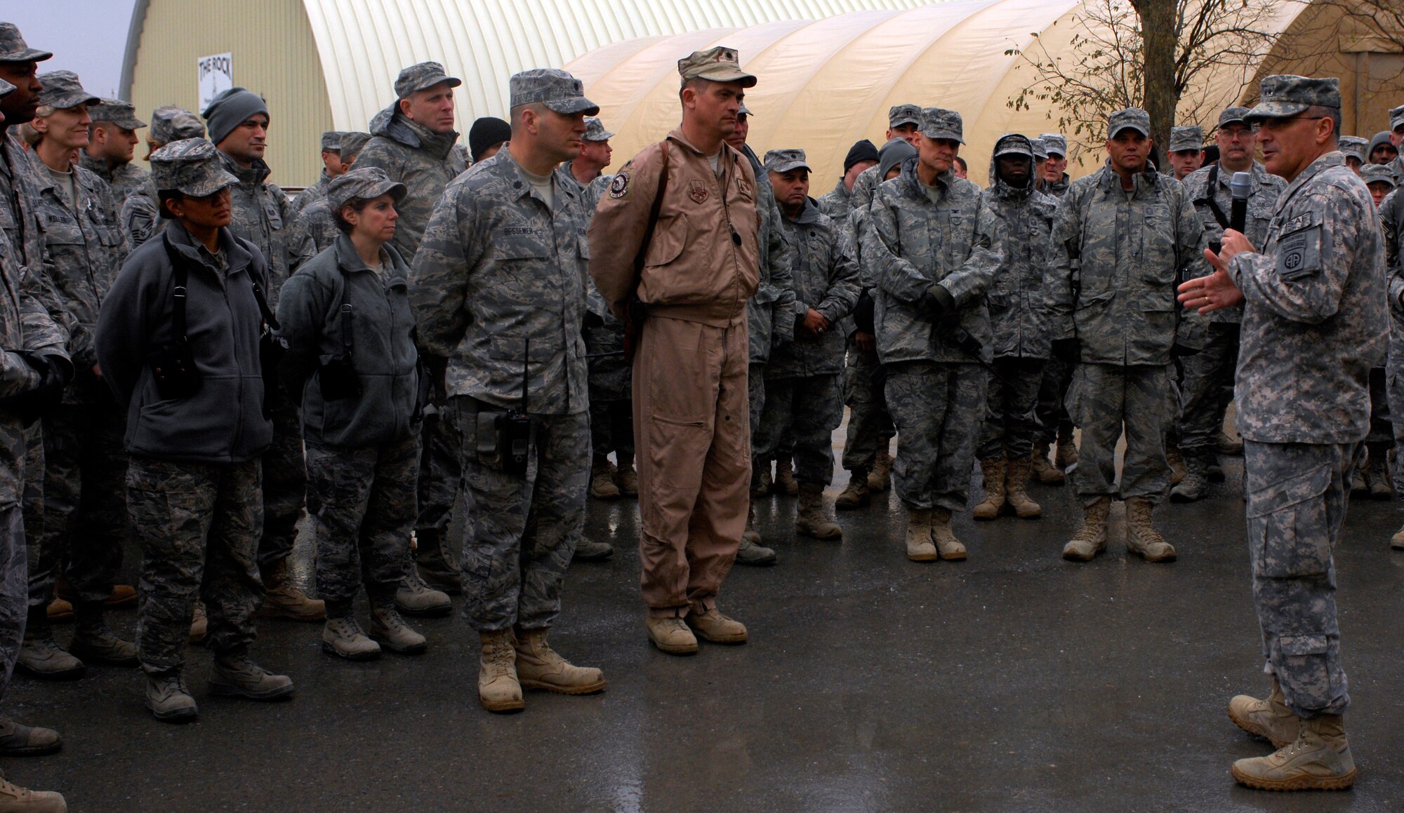 BAGRAM AIRFIELD, Afghanistan -- Senior Army leaders from Combined Joint Task Force - 82 address a crowd of Airmen in front of 455th Air Expeditionary Wing headquarters Nov. 23, 2009. Maj. Gen. Curtis Scaparrotti, CJTF-82 commander, and Command Sgt. Major Thomas Capel thanked them for their contributions to the mission in Afghanistan. "We know your families miss you, but it's important for us to be here," General Scaparrotti said. "Soldiers and Marines on the ground know they can rely on Airmen to bring them air power when they need it." (U.S. Air Force photo/Staff Sgt. J.G. Buzanowski)