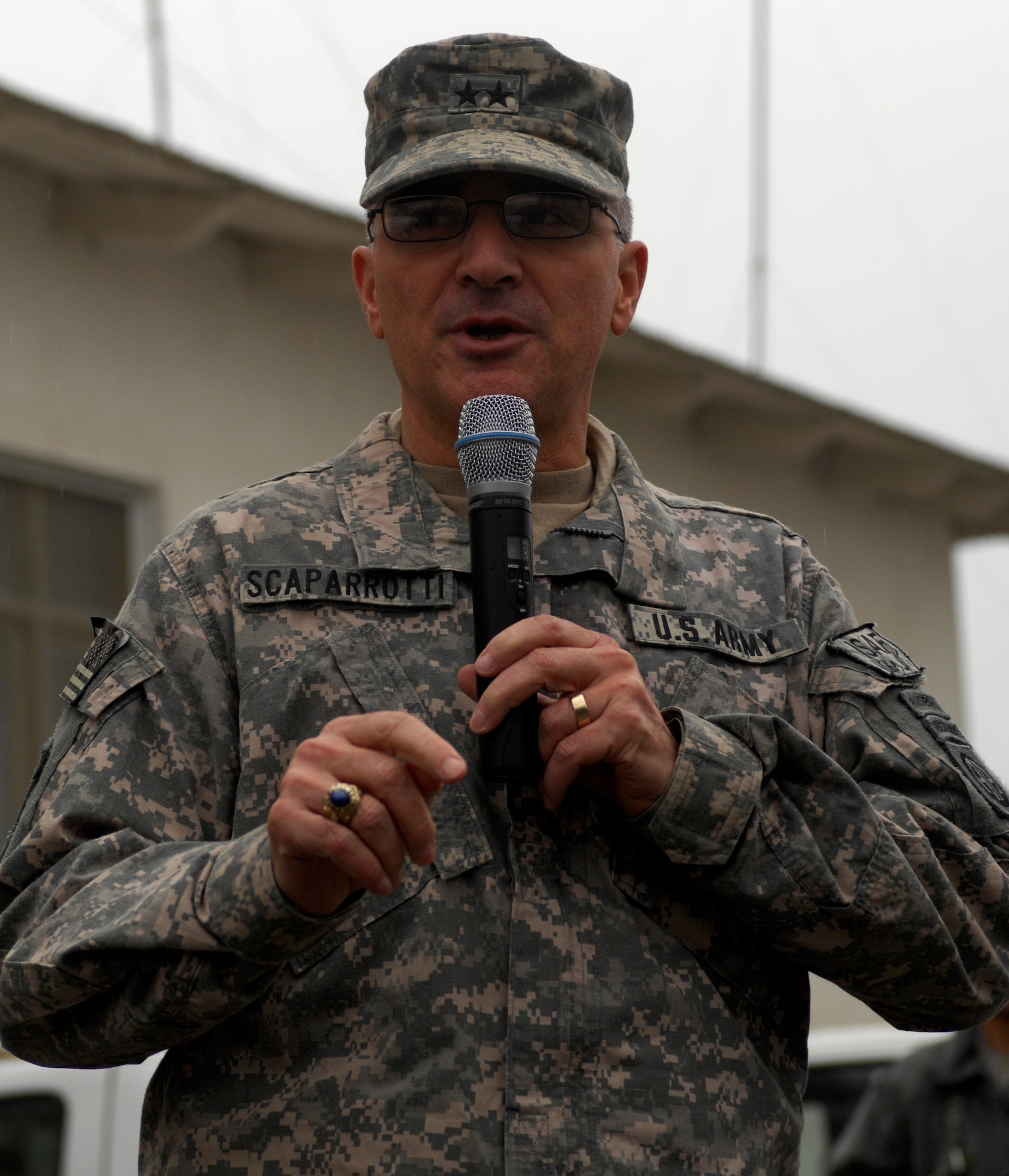 BAGRAM AIRFIELD, Afghanistan -- Senior Army leaders from Combined Joint Task Force - 82 address a crowd of Airmen in front of 455th Air Expeditionary Wing headquarters Nov. 23, 2009. Maj. Gen. Curtis Scaparrotti, CJTF-82 commander, and Command Sgt. Major Thomas Capel thanked them for their contributions to the mission in Afghanistan. "We know your families miss you, but it's important for us to be here," General Scaparrotti said. "Soldiers and Marines on the ground know they can rely on Airmen to bring them air power when they need it." (U.S. Air Force photo/Staff Sgt. J.G. Buzanowski)