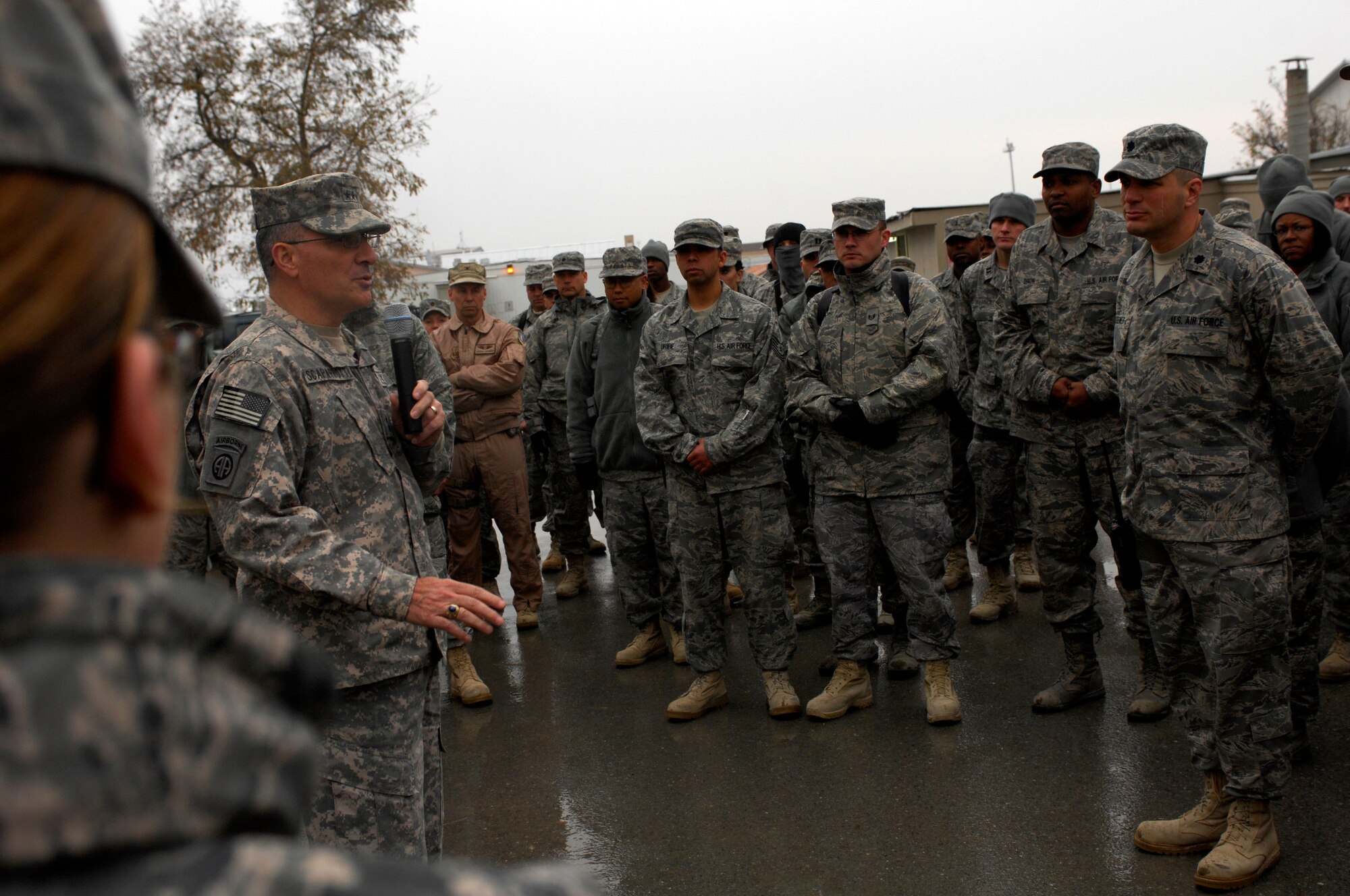 BAGRAM AIRFIELD, Afghanistan -- Senior Army leaders from Combined Joint Task Force - 82 address a crowd of Airmen in front of 455th Air Expeditionary Wing headquarters Nov. 23, 2009. Maj. Gen. Curtis Scaparrotti, CJTF-82 commander, and Command Sgt. Major Thomas Capel thanked them for their contributions to the mission in Afghanistan. "We know your families miss you, but it's important for us to be here," General Scaparrotti said. "Soldiers and Marines on the ground know they can rely on Airmen to bring them air power when they need it." (U.S. Air Force photo/Staff Sgt. J.G. Buzanowski)