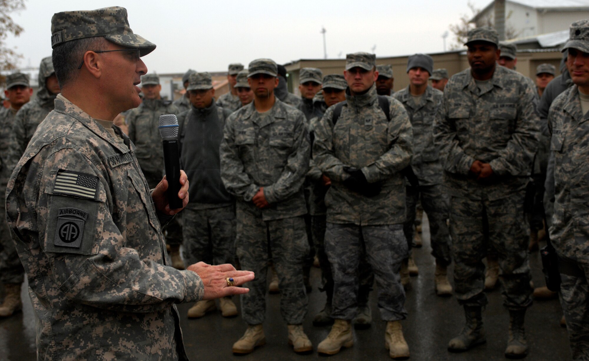 BAGRAM AIRFIELD, Afghanistan -- Senior Army leaders from Combined Joint Task Force - 82 address a crowd of Airmen in front of 455th Air Expeditionary Wing headquarters Nov. 23, 2009. Maj. Gen. Curtis Scaparrotti, CJTF-82 commander, and Command Sgt. Major Thomas Capel thanked them for their contributions to the mission in Afghanistan. "We know your families miss you, but it's important for us to be here," General Scaparrotti said. "Soldiers and Marines on the ground know they can rely on Airmen to bring them air power when they need it." (U.S. Air Force photo/Staff Sgt. J.G. Buzanowski)