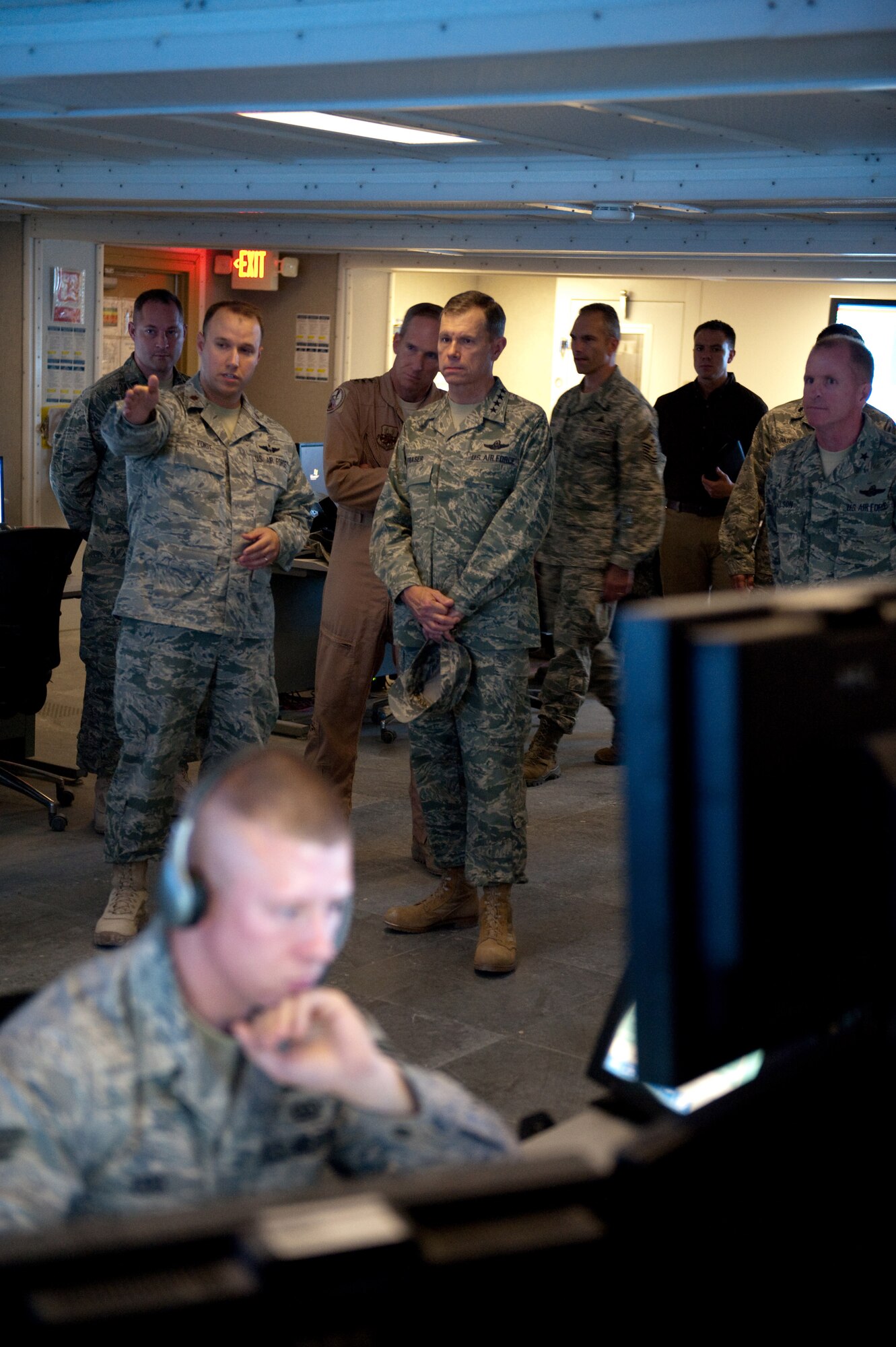 Left, Maj. Kenneth Voigt, 71st Expeditionary Air Control Squadron director of operations, highlights the mission of the Battlespace Command and Control Center for Gen. William Fraser III, Air Combat Command commander, Nov. 22, 2009, in Southwest Asia. ACC senior leaders were visiting with deployed servicemembers as part of a U.S. Central Command area of responsibility tour. (U.S. Air Force photo/Staff Sgt. Robert Barney)