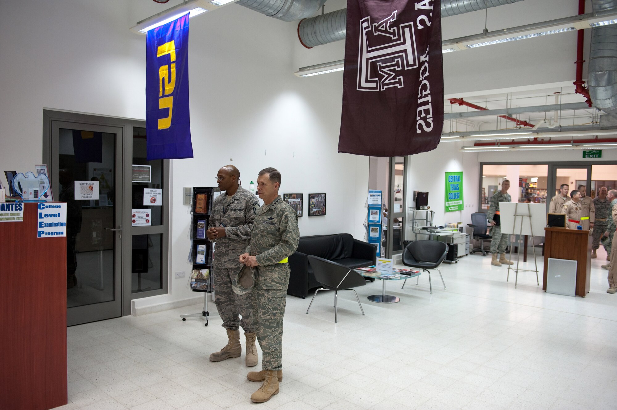 U.S. Air Force Senior Master Sgt. James Rice, 379th Expeditionary Force Support Squadron, discusses the Education Center mission and programs to Commander of Air Combat Command, Gen. William Fraser III, Nov. 22, 2009, in Southwest Asia.  ACC senior leaders were visiting with deployed servicemembers as part of a U.S. Central Command area of responsibility tour. (U.S. Air Force photo/Staff Sgt. Robert Barney)