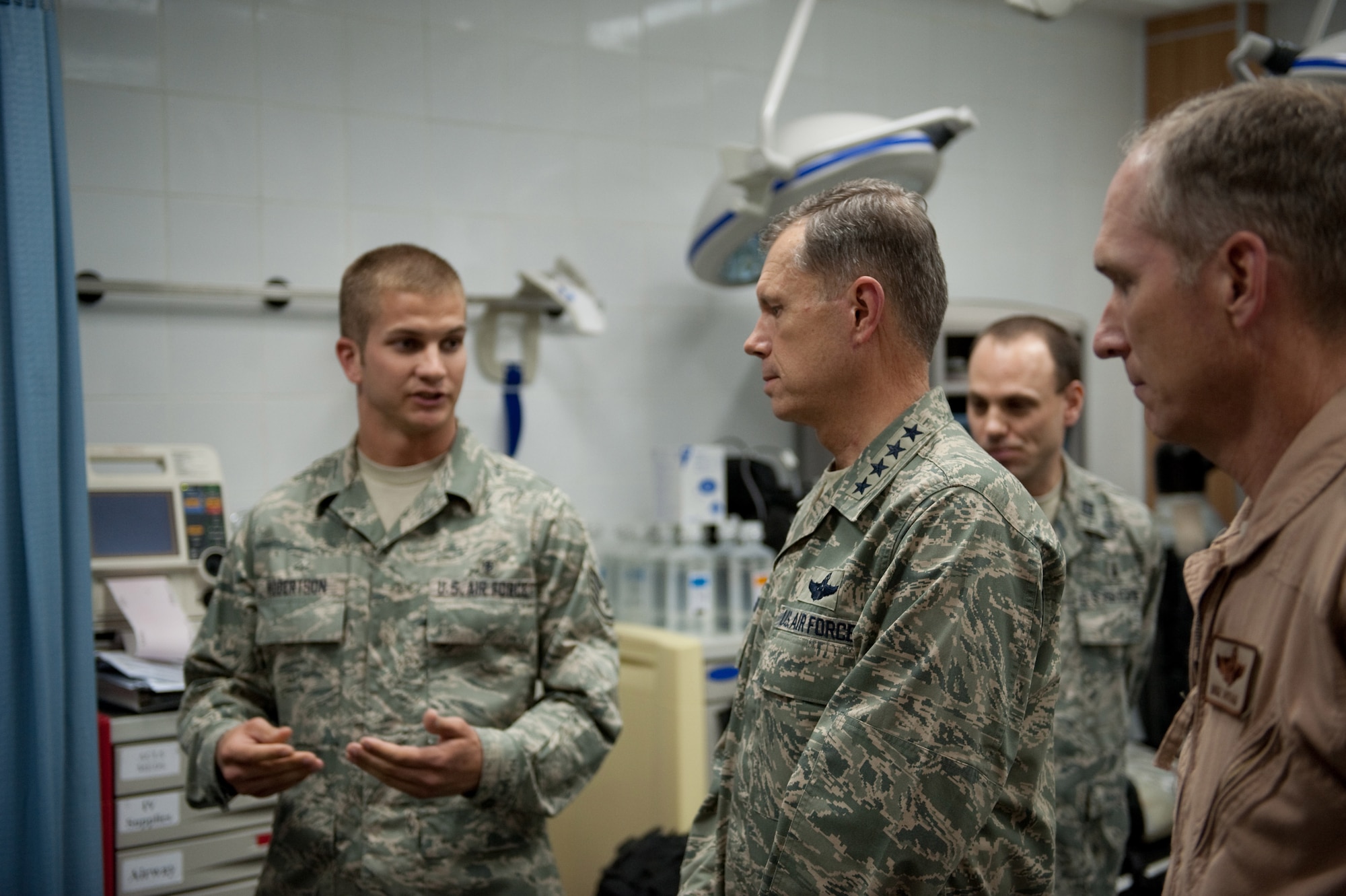 Staff Sgt. Allyn Robertson, 379th Expeditionary Medical Group bioenvironmental engineering flight, describes the mission of the 379 EMDG BEE flight to Commander of Air Combat Command, Gen. William Fraser III, Nov. 22, 2009, in Southwest Asia. ACC senior leaders were visiting with deployed servicemembers as part of a U.S. Central Command area of responsibility tour. (U.S. Air Force photo/Staff Sgt. Robert Barney)