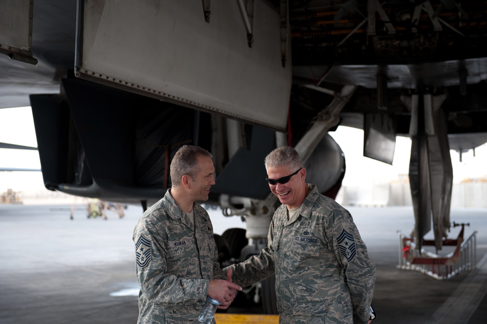Command Chief of Air Combat Command, Chief Master Sgt. Martin Klukas, visits with the 379th Air Expeditionary Wing Command Chief, Chief Master Sgt. David Green, during a tour of the B-1B Lancer, Nov. 22, 2009, in Southwest Asia. ACC senior leaders were visiting with deployed servicemembers as part of a U.S. Central Command area of responsibility tour. (U.S. Air Force photo/Staff Sgt. Robert Barney)
