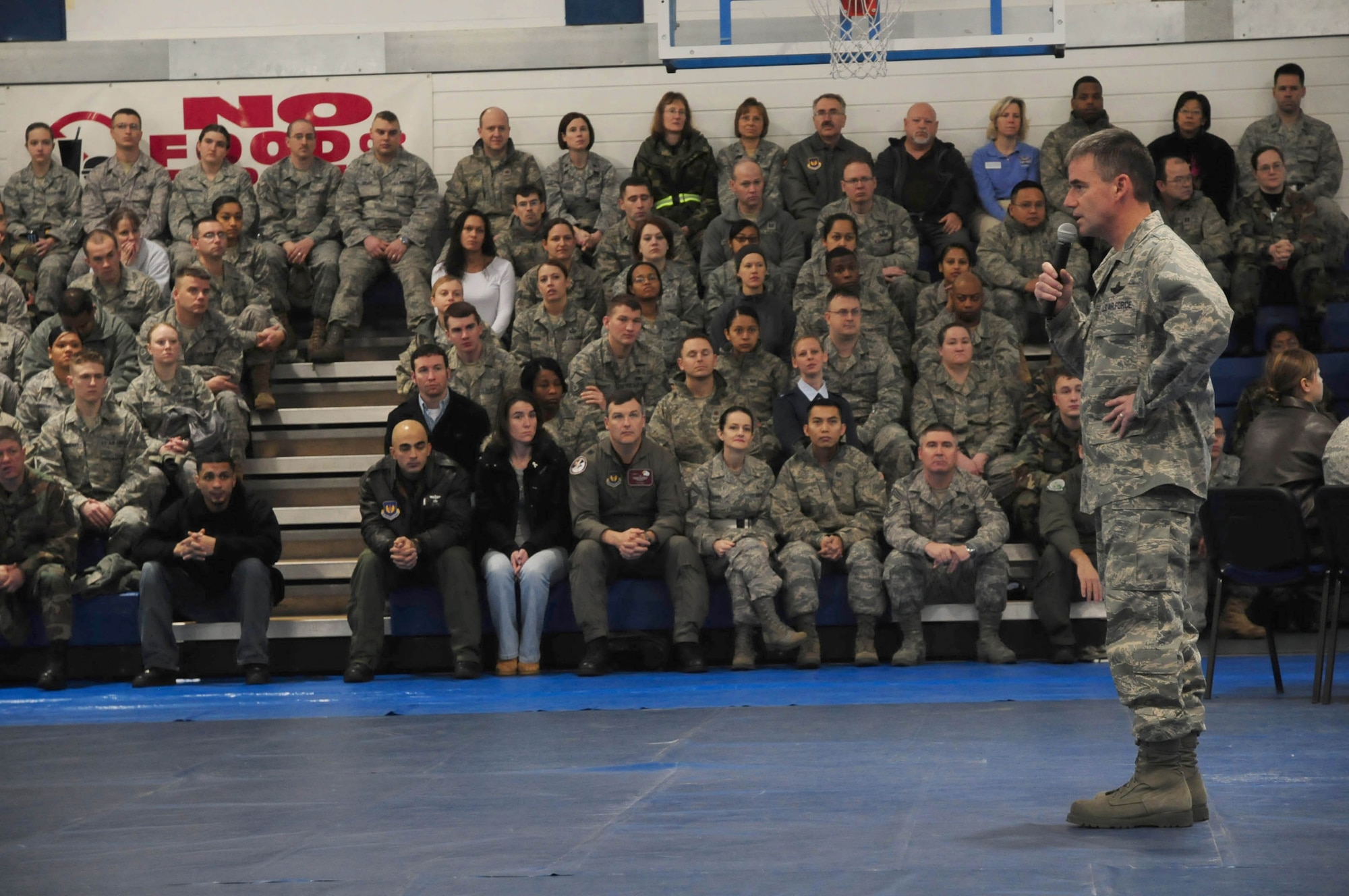 ROYAL AIR FORCE LAKENHEATH, England -- Col. Jay Silveria, 48th Fighter Wing commander, gives a commander’s call at the base gym Nov. 20.  Recognition, quality of life, safety, drinking and driving and accountability were some of the things the commander spoke about to the more than 4,000 Liberty Warriors throughout the day.
 (U.S. Air Force photo by Staff Sgt. Connor Estes)   

