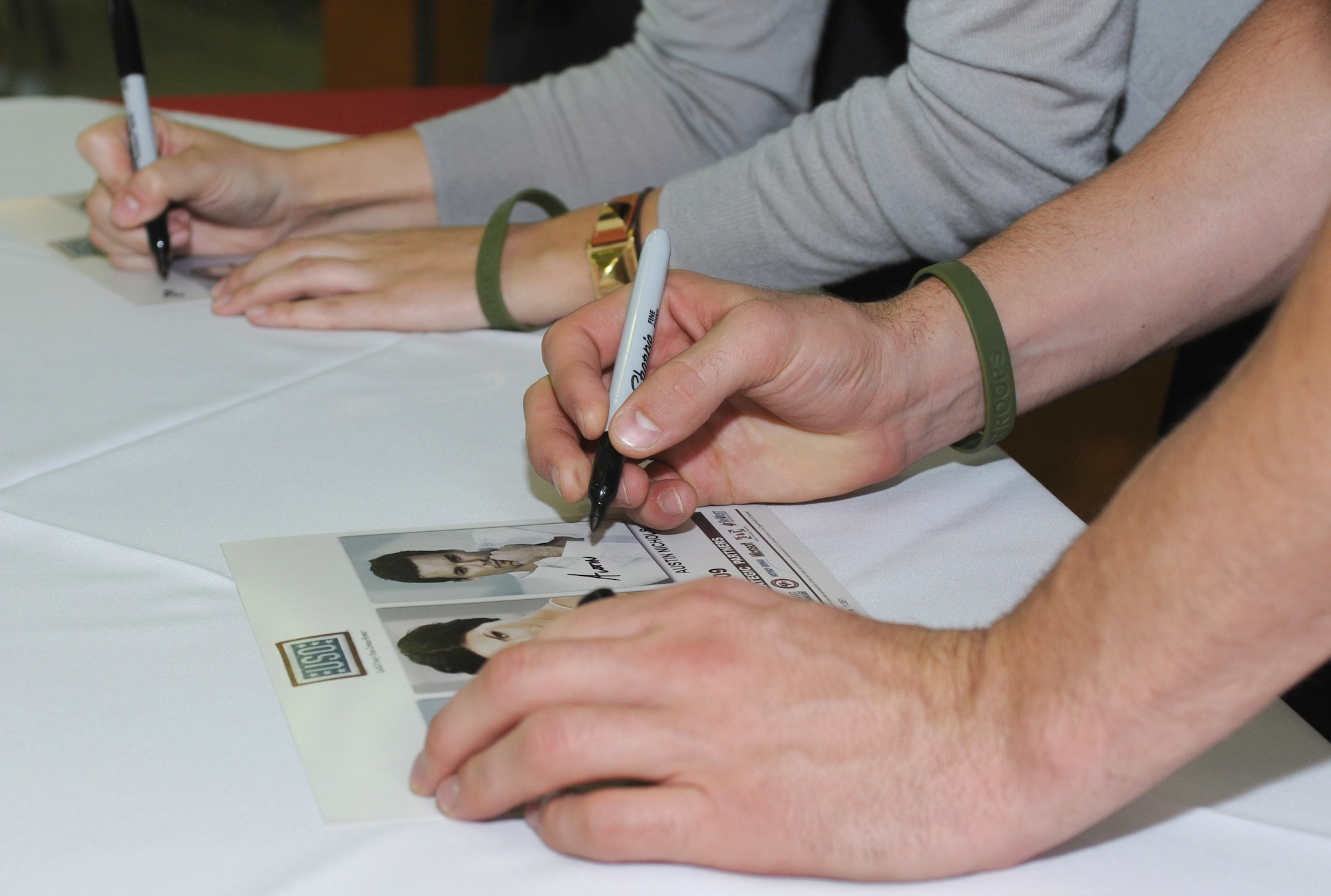 Austin Nichols and Sophia Bush, celebrity guests from the television show One Tree Hill, sign autographs, Monday, Nov.23, 2009 at Incirlik’s BX food court.  Both celebrities, along with Milo Ventimiglia  from the television show Heroes, are visiting Incirlik as part of the celebrity handshake tour sponsored by United Service Organizations.  (U.S. Air Force photo/Senior Airman Ashley Wood)  