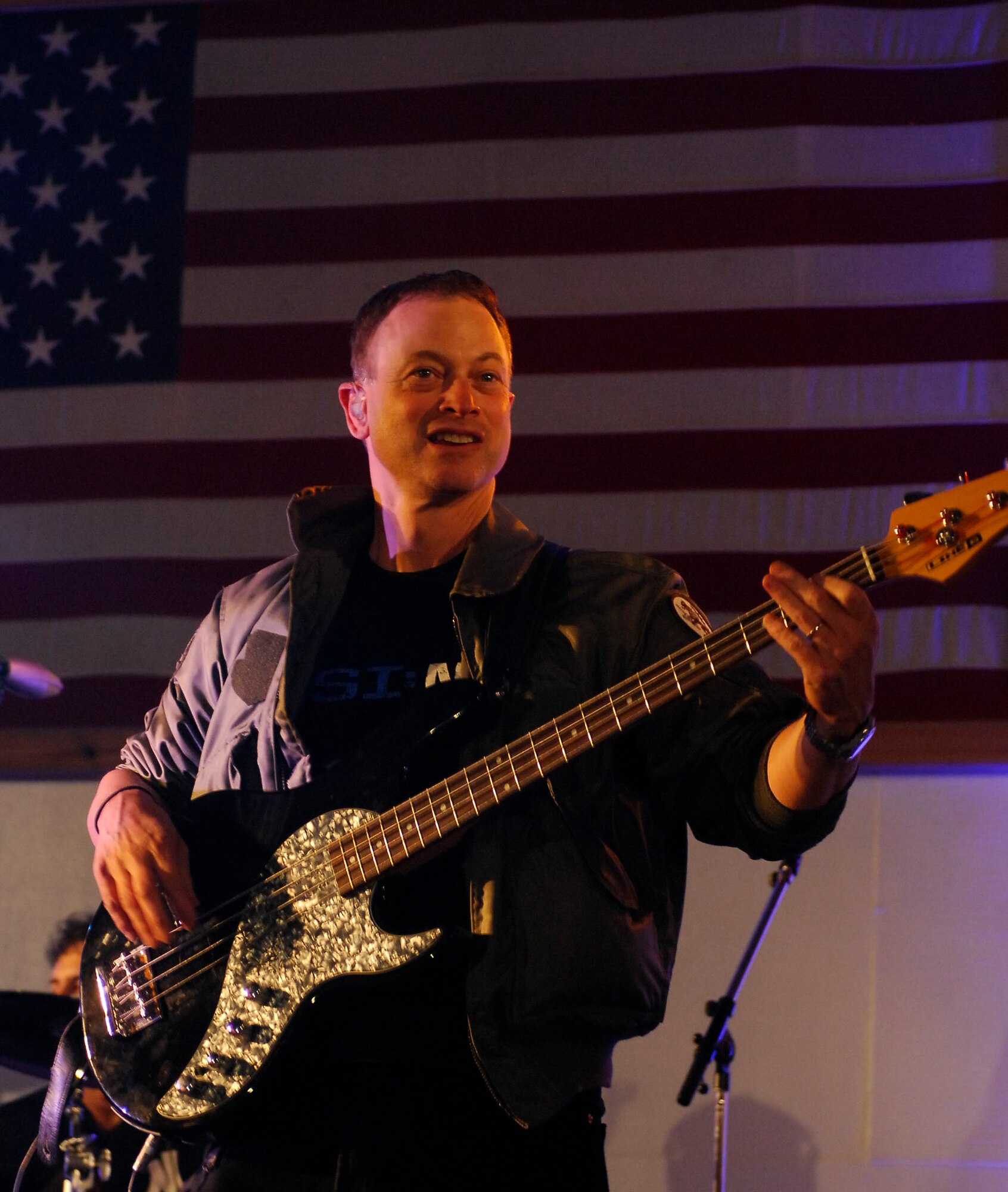 BAGRAM AIRFIELD, Afghanistan -- Gary Sinise and Kimo Williams met in 1997 while working together on a play called "A Streetcar Named Desire," in Chicago. They continued to meet and have jam sessions on the guitar and bass, gradually adding other musicians. The Lt. Dan Band did their first USO tour in 2004, visiting Korea, Singapore and Diego Garcia - since then they average 30-40 shows a year, with 75% of the profits going towards the USO and other charities. The band name was chosen because Mr. Sinise was constantly recognized by a character he played in the movie "Forrest Gump" called Lt. Dan. (U.S. Air Force photo/ Senior Airman Susan Tracy)