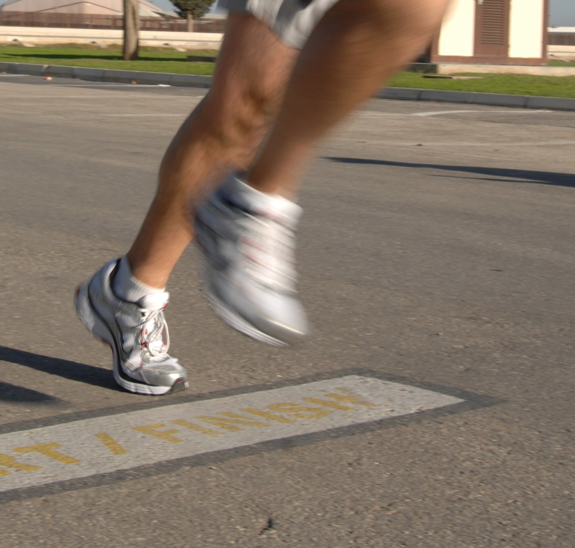 Master Sgt. Chester Balderson, 39th Communications Squadron, crosses the finish line of the 5K Turkey Trot Saturday, Nov. 21, 2009, at Incirlik Air Base, Turkey. Capt. Andrew Beckett, 817th Expeditionary Airlift Squadron crossed the finish line first with a time of 17 minutes 36 seconds. The fitness center hosted the event and AAFES gift cards were given to the first two males and first female to cross the finish line. (U.S. Air Force photo/Staff Sgt. Lauren Padden) 
