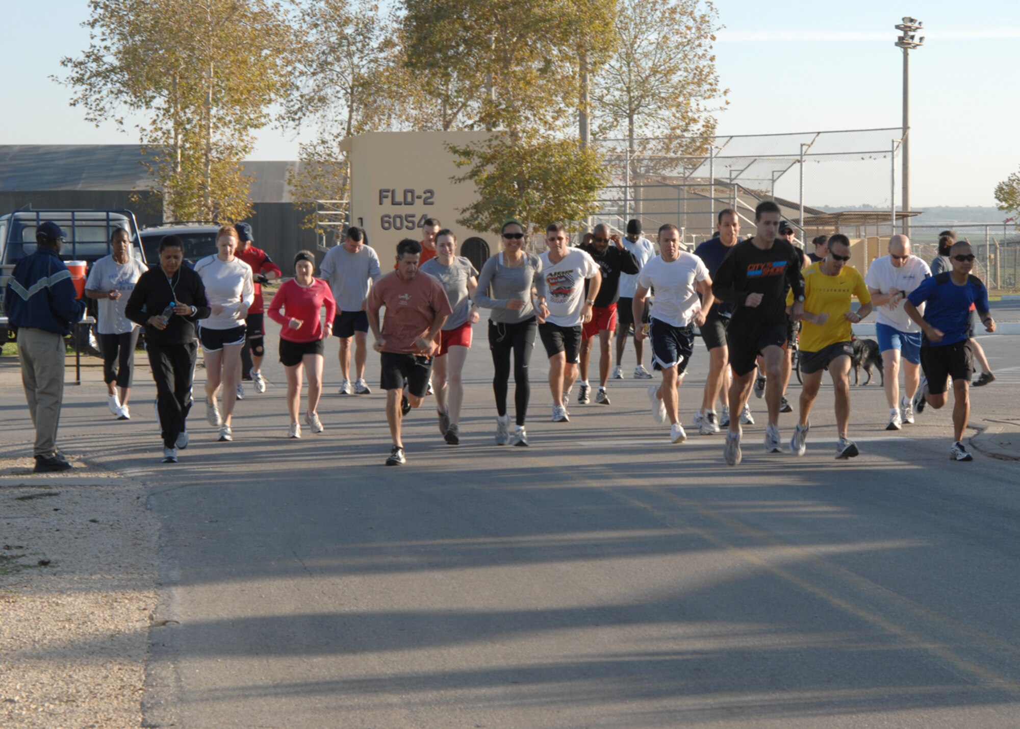 Members of Team Incirlik take off from the starting line of the 5K Turkey Trot Saturday, Nov. 21, 2009, at Incirlik Air Base, Turkey. Capt. Andrew Beckett, 817th Expeditionary Airlift Squadron crossed the finish line first with a time of 17 minutes 36 seconds. The fitness center hosted the event and AAFES gift cards were given to the first two males and first female to cross the finish line. (U.S. Air Force photo/Staff Sgt. Lauren Padden) 
