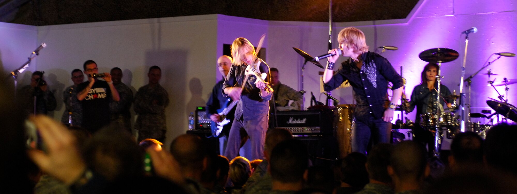 BAGRAM AIRFIELD, Afghanistan -- Gary Sinise and Kimo Williams met in 1997 while working together on a play called "A Streetcar Named Desire," in Chicago. They continued to meet and have jam sessions on the guitar and bass, gradually adding other musicians. The Lt. Dan Band did their first USO tour in 2004, visiting Korea, Singapore and Diego Garcia - since then they average 30-40 shows a year, with 75% of the profits going towards the USO and other charities. The band name was chosen because Mr. Sinise was constantly recognized by a character he played in the movie "Forrest Gump" called Lt. Dan. (U.S. Air Force photo/ Senior Airman Susan Tracy)