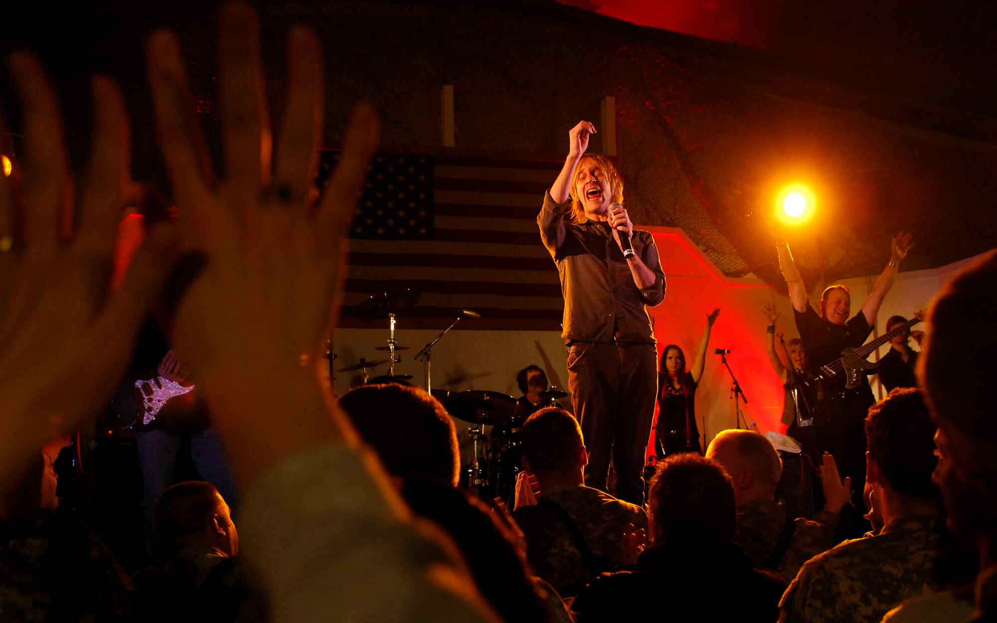 BAGRAM AIRFIELD, Afghanistan -- Gary Sinise and Kimo Williams met in 1997 while working together on a play called "A Streetcar Named Desire," in Chicago. They continued to meet and have jam sessions on the guitar and bass, gradually adding other musicians. The Lt. Dan Band did their first USO tour in 2004, visiting Korea, Singapore and Diego Garcia - since then they average 30-40 shows a year, with 75% of the profits going towards the USO and other charities. The band name was chosen because Mr. Sinise was constantly recognized by a character he played in the movie "Forrest Gump" called Lt. Dan. (U.S. Air Force photo/ Senior Airman Susan Tracy)