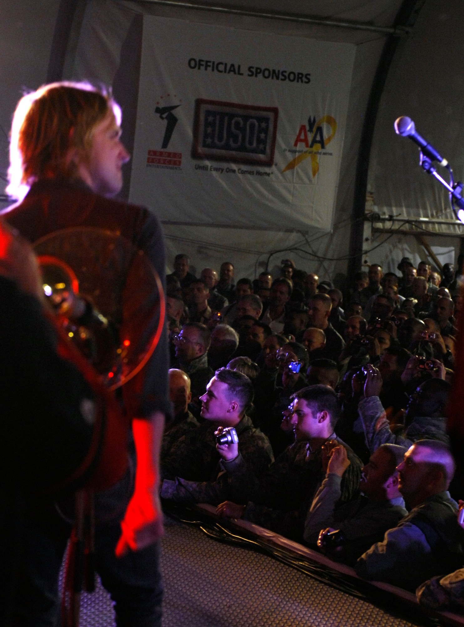 BAGRAM AIRFIELD, Afghanistan -- Gary Sinise and Kimo Williams met in 1997 while working together on a play called "A Streetcar Named Desire," in Chicago. They continued to meet and have jam sessions on the guitar and bass, gradually adding other musicians. The Lt. Dan Band did their first USO tour in 2004, visiting Korea, Singapore and Diego Garcia - since then they average 30-40 shows a year, with 75% of the profits going towards the USO and other charities. The band name was chosen because Mr. Sinise was constantly recognized by a character he played in the movie "Forrest Gump" called Lt. Dan. (U.S. Air Force photo/ Senior Airman Susan Tracy)