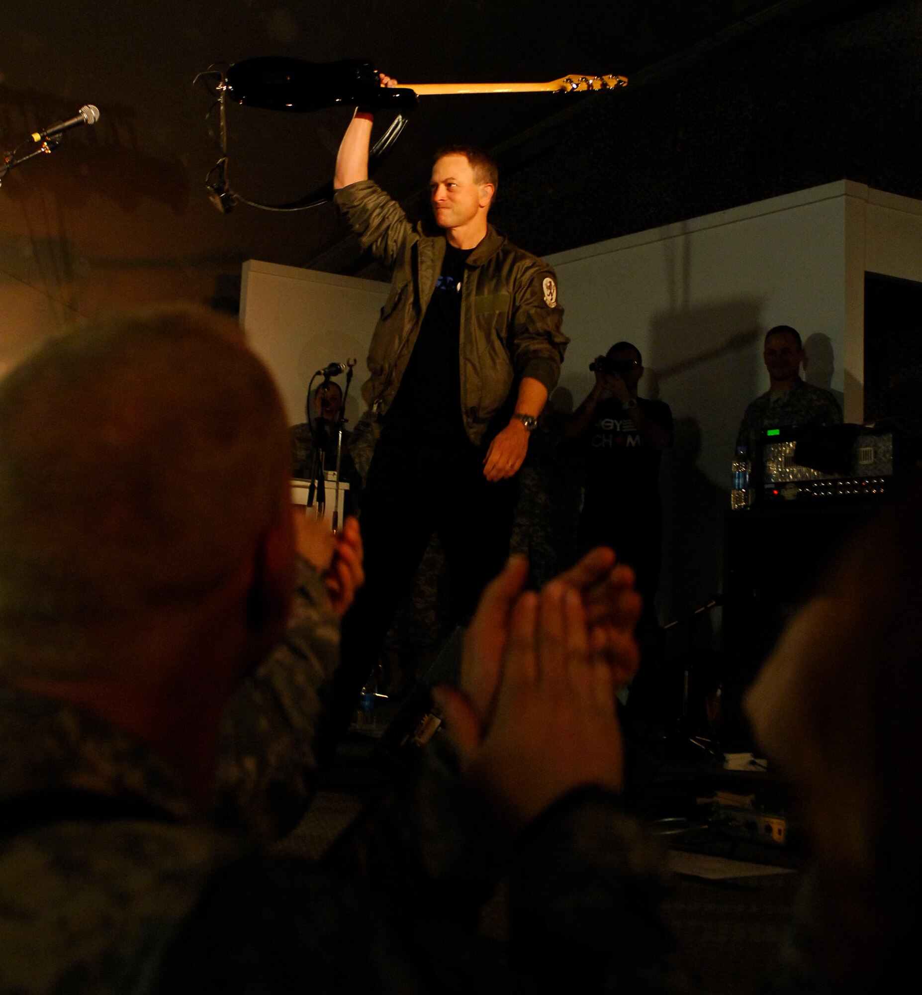 BAGRAM AIRFIELD, Afghanistan -- Gary Sinise and Kimo Williams met in 1997 while working together on a play called "A Streetcar Named Desire," in Chicago. They continued to meet and have jam sessions on the guitar and bass, gradually adding other musicians. The Lt. Dan Band did their first USO tour in 2004, visiting Korea, Singapore and Diego Garcia - since then they average 30-40 shows a year, with 75% of the profits going towards the USO and other charities. The band name was chosen because Mr. Sinise was constantly recognized by a character he played in the movie "Forrest Gump" called Lt. Dan. (U.S. Air Force photo/ Senior Airman Susan Tracy)