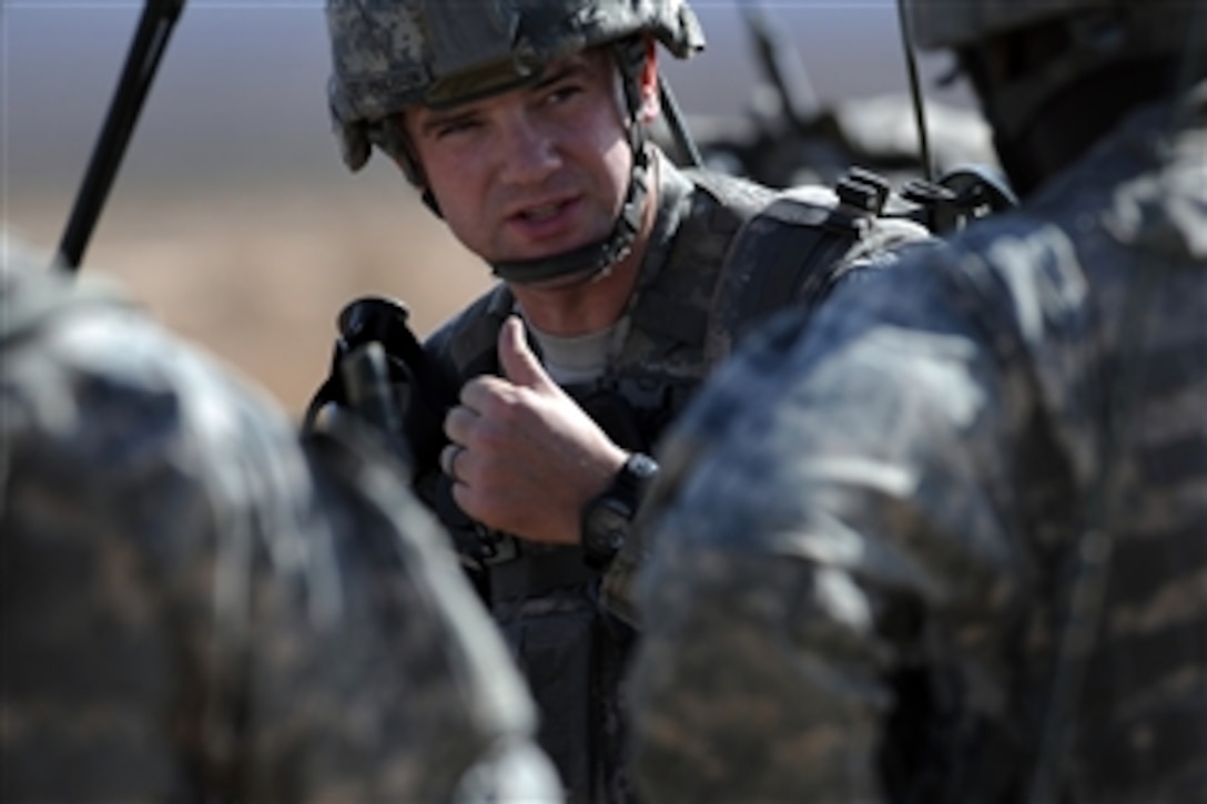 U.S. Army Capt. Michael Anderson, commander of Bravo Troop, 173 Cavalry Airborne Reconnaissance Squadron, gives instruction to his squad leaders before moving to the Urban Operations Complex on the Nevada Test and Training Range in the desert of southern Nevada on Nov. 18, 2009.  The soldiers were airdropped into the range by U.S. Air Force C-17 Globemaster III and C-130 Hercules aircraft.  The soldiers and aircraft are taking part in the bi-annual U.S. Air Force Weapons School exercise, which provides realistic training for combat Air Force, mobility Air Force and U.S. Army personnel.  Approximately 40 C-17 and C-130 aircraft from Air Force bases around the world dropped approximately 400 soldiers on the training range.  The exercise also allows soldiers the opportunity to use range facilities to conduct urban ground operations training.  