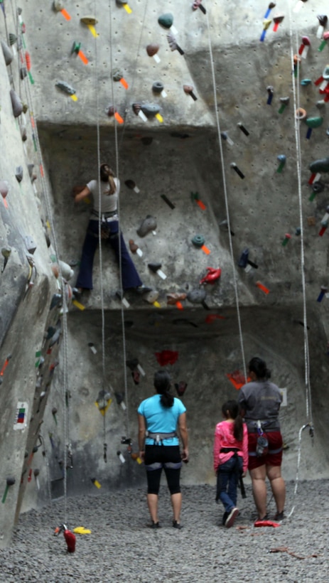 A Rock climber uses her upper body strength at San Diego’s Solid Rock Gym Nov. 24. Rock climbing can be a fun and effective way to help prepare Marines for the Combat Fitness Test. Solid Rock Gym has more than 115 top ropes, making it difficult to replicate climbing routes. Marines can increase their physical and mental health, particularly upper body strength through rock climbing. The gym serves as a worthwhile activity for Marines during their free time.