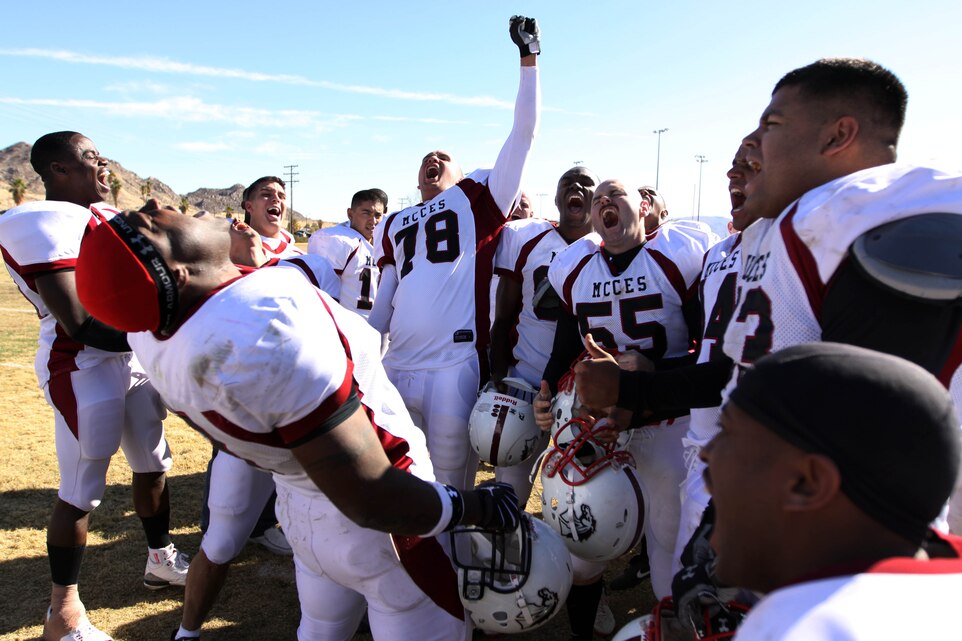 Players with the Marine Corps Communications Electronics-School Eagles celebrate at midfield after knocking off the Headquarters Battalion Bulldawgs 24-6, during the Commanding General’s Intramural Football League Championship game Nov. 25 at Felix Field. The Eagles are slated to face Marine Corps Air Station Miramar, Calif., in the annual Best of the West Competition here Dec. 12.