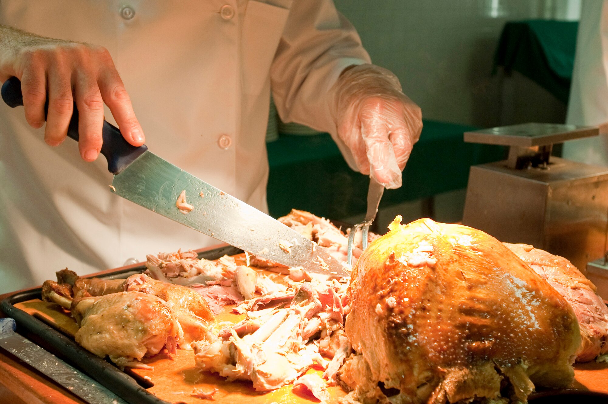 MISAWA AIR BASE, Japan -- Col. RC Craig, 35th Fighter Wing vice commander, carves turkey at the Grissom Dining Facility on Thanksgiving, Nov. 26. The dining facility cooked-up a hot Thanksgiving meal for military members who did not have local family to spend the holiday with. (U.S. Air Force photo/Staff Sgt. Samuel Morse)
