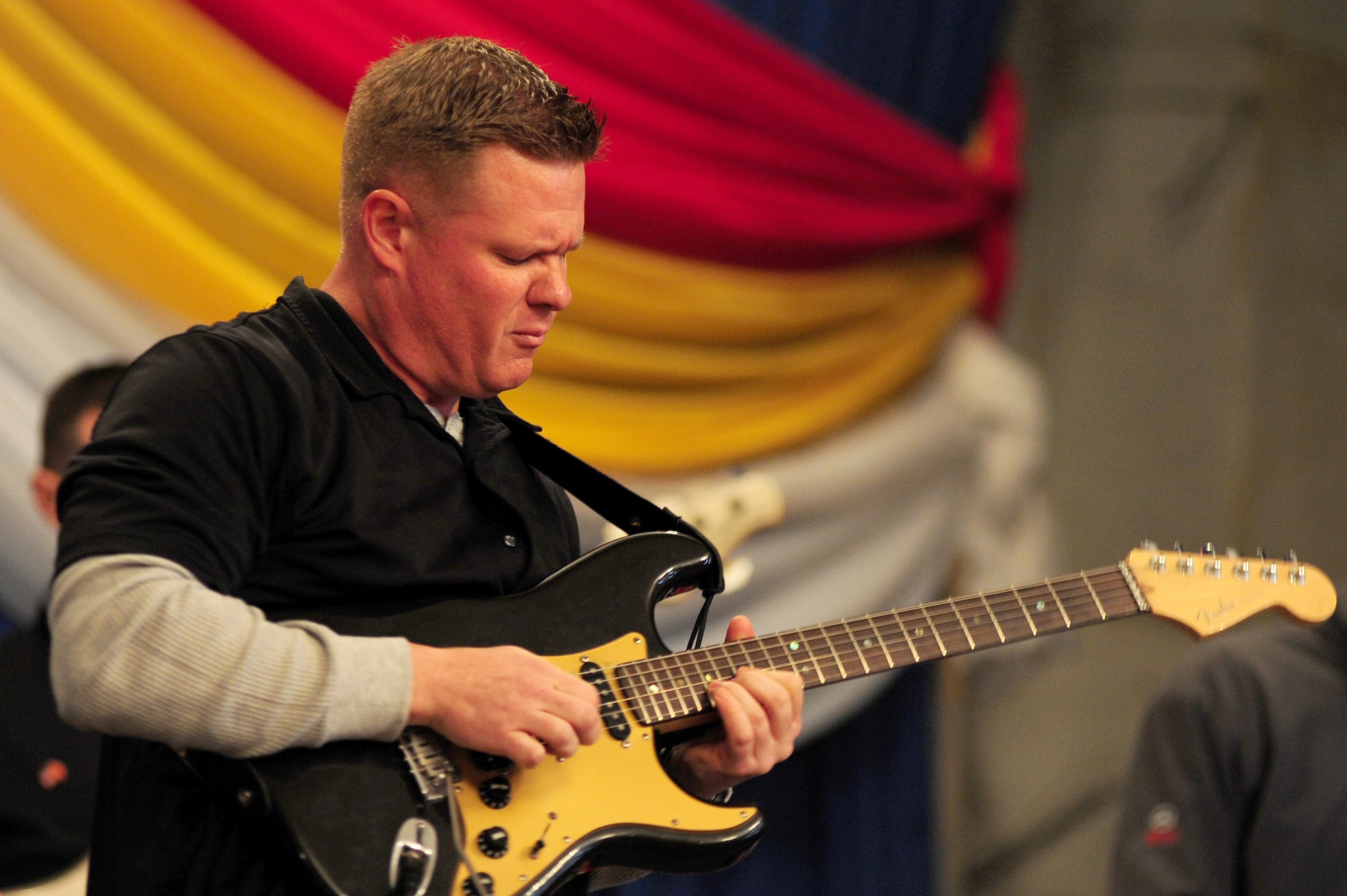 BISHKEK, Kyrgyzstan -- Tech. Sgt. Steve Wilson, U.S. Air Forces Central Sirocco Band guitarist, performs for an audience in Kyrgyzstan, Nov. 18, 2009. (U.S. Air Force photo/Senior Airman Steele C. G. Britton)