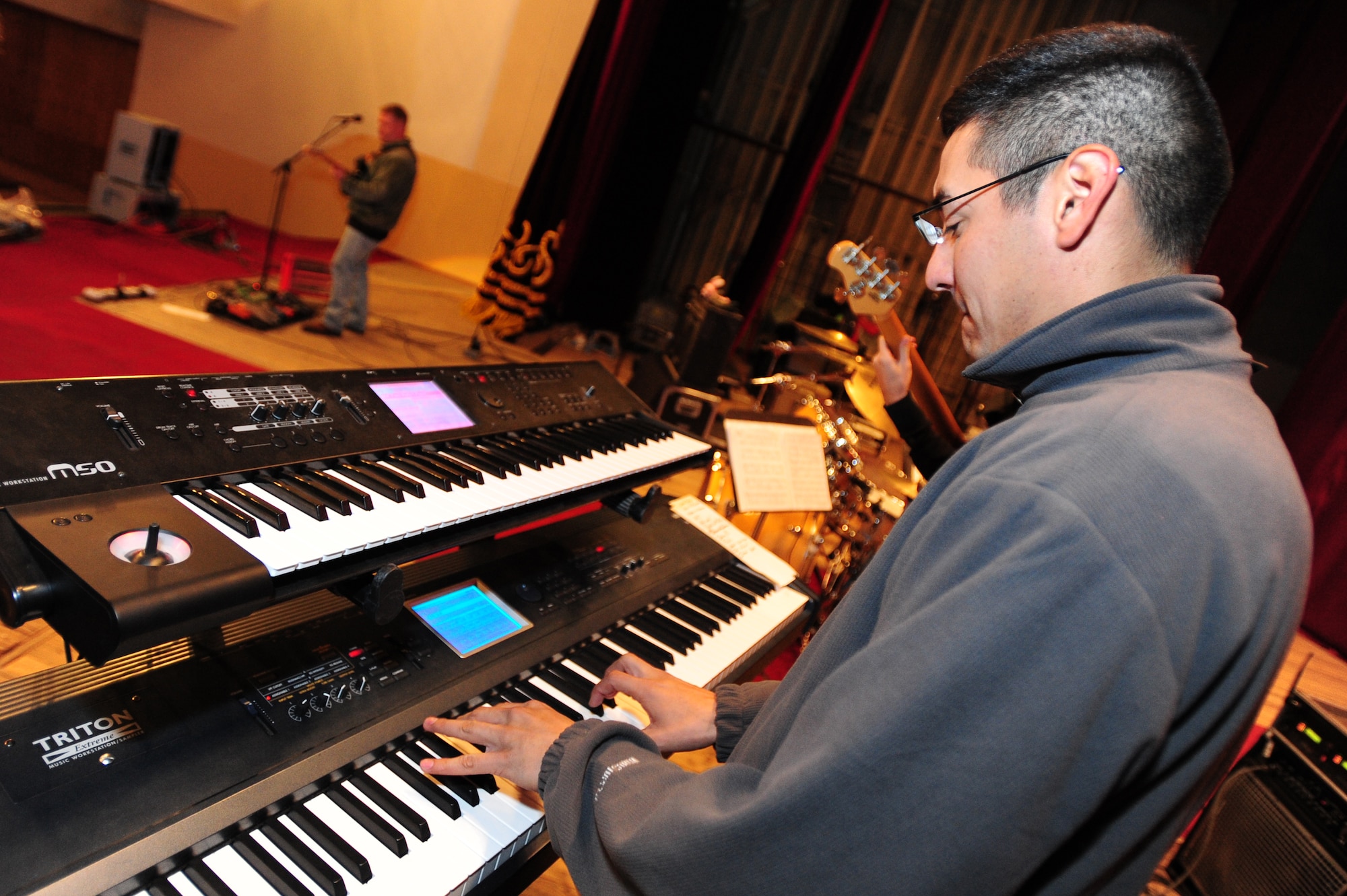 TOK MOK, Kyrgyzstan -- Airman 1st Class Dennis Lambert, U.S. Air Forces Central Sirocco Band keyboard player, plays for an audience in Kyrgyzstan, Nov. 17, 2009. (U.S. Air Force photo/Senior Airman Steele C. G. Britton)